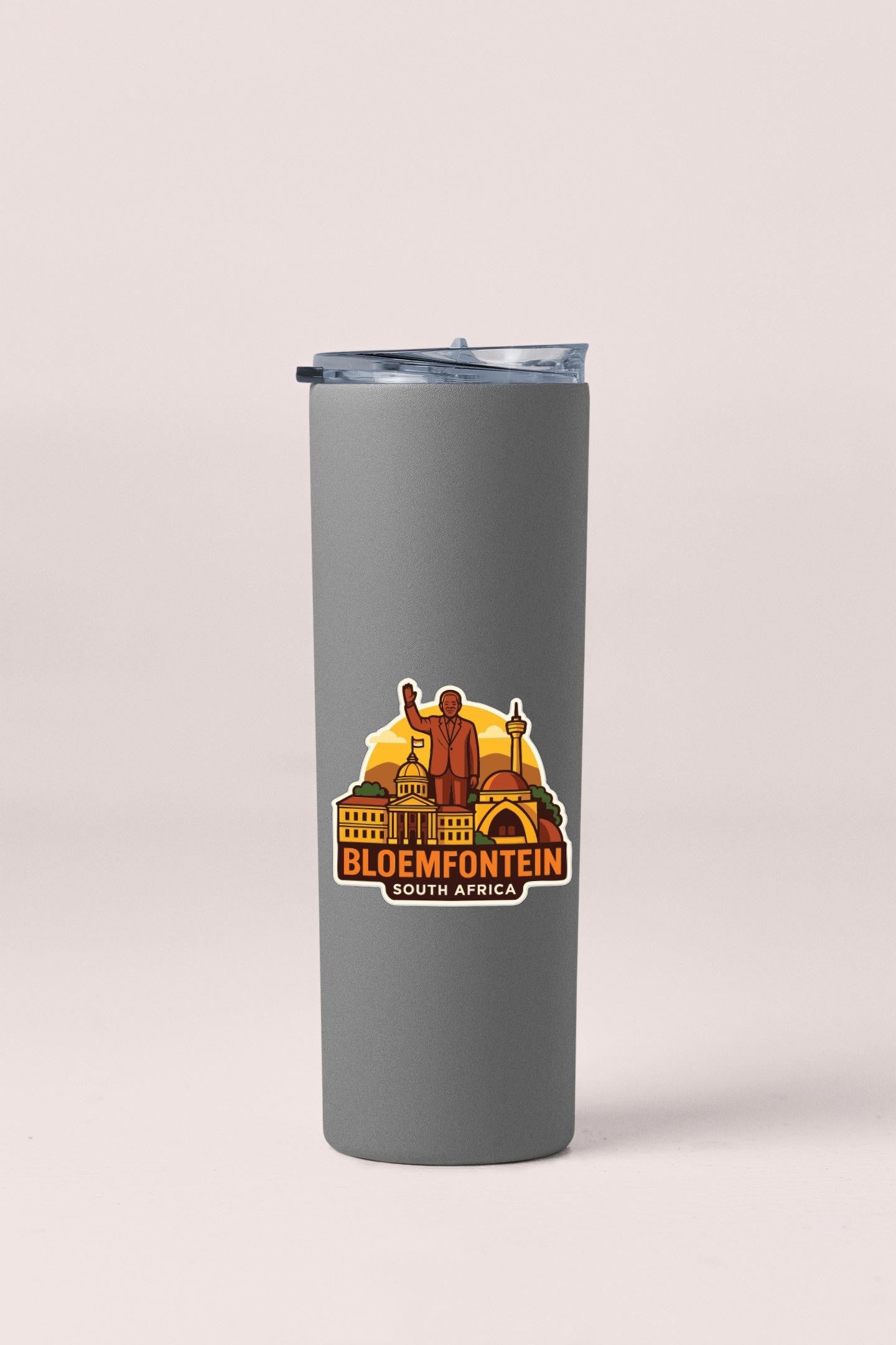 A gray insulated tumbler with a sticker depicting a city skyline and the text "BLOEMFONTEIN SOUTH AFRICA".
