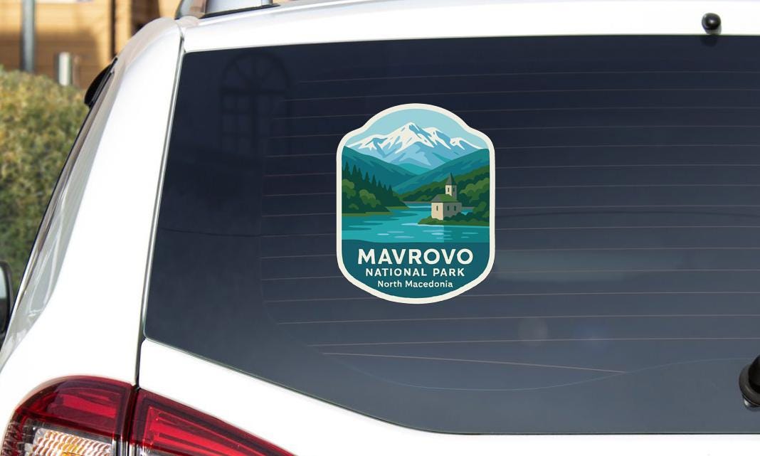 a sticker on the rear window of a car that says "MAVROVO NATIONAL PARK NORTH MAFEODON".