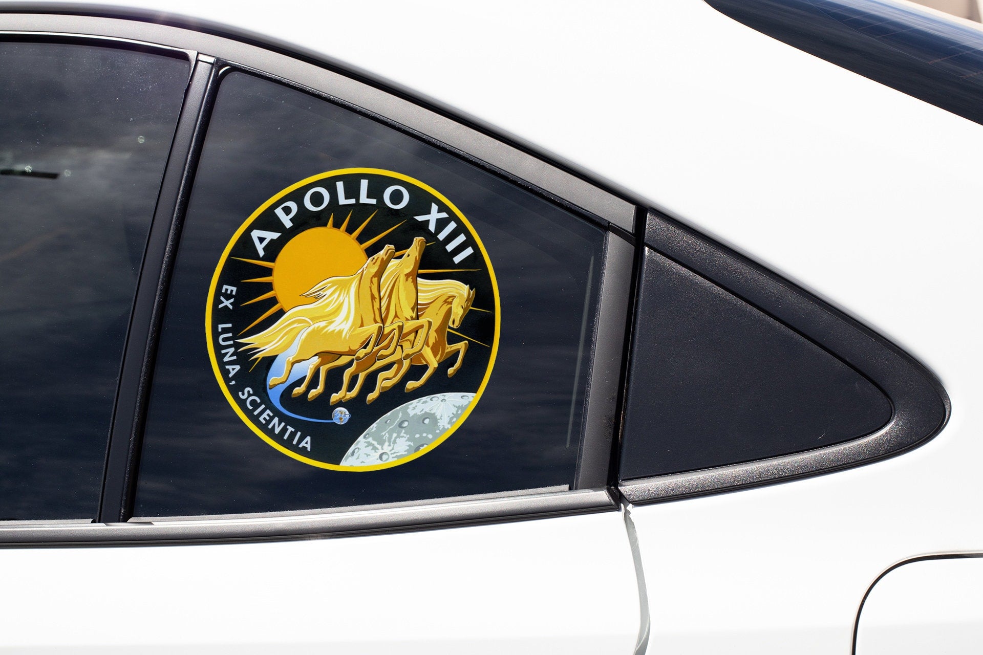 a close up of a car mirror with a logo on it
