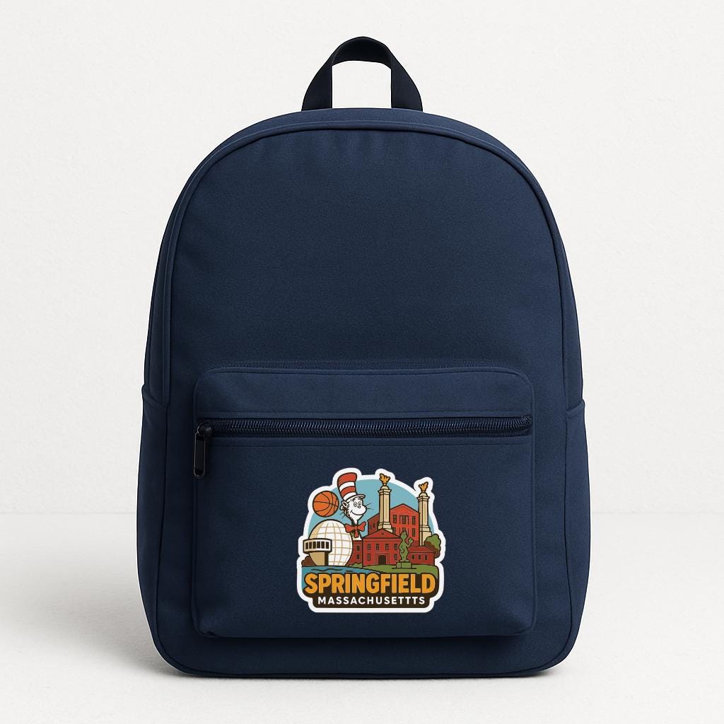 A navy blue backpack with a sticker on the front that features an illustration of a city skyline and the text "Springfield Massachusetts".