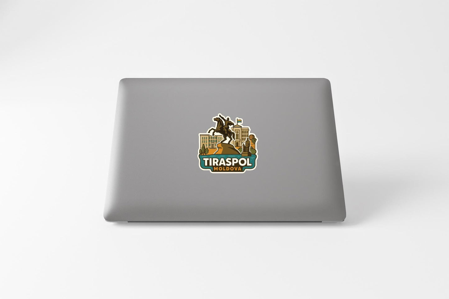 a sticker with a graphic of a horse and rider on the back of a laptop.