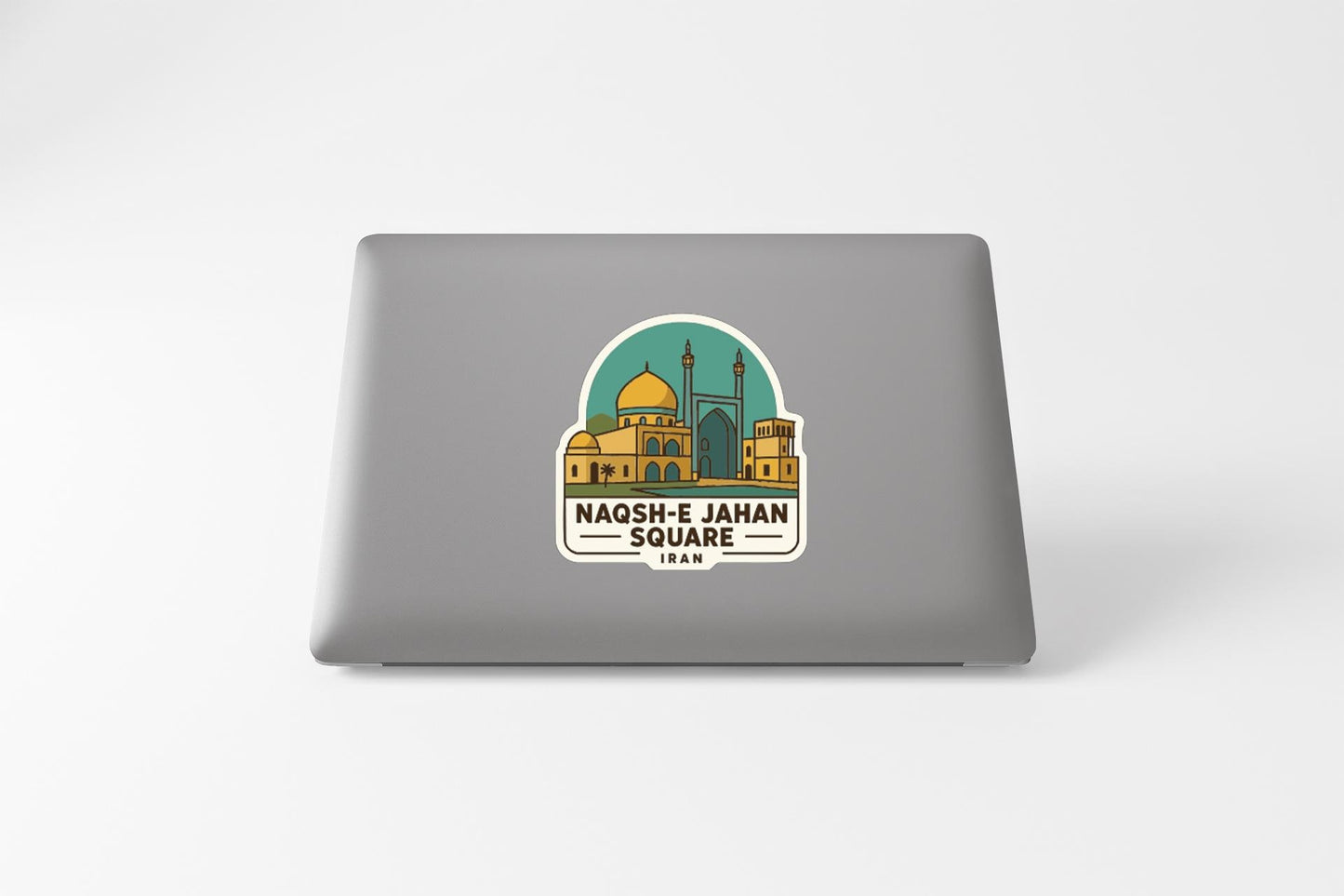 a sticker or decal on the back of a laptop, depicting a mosque with a dome and minaret.