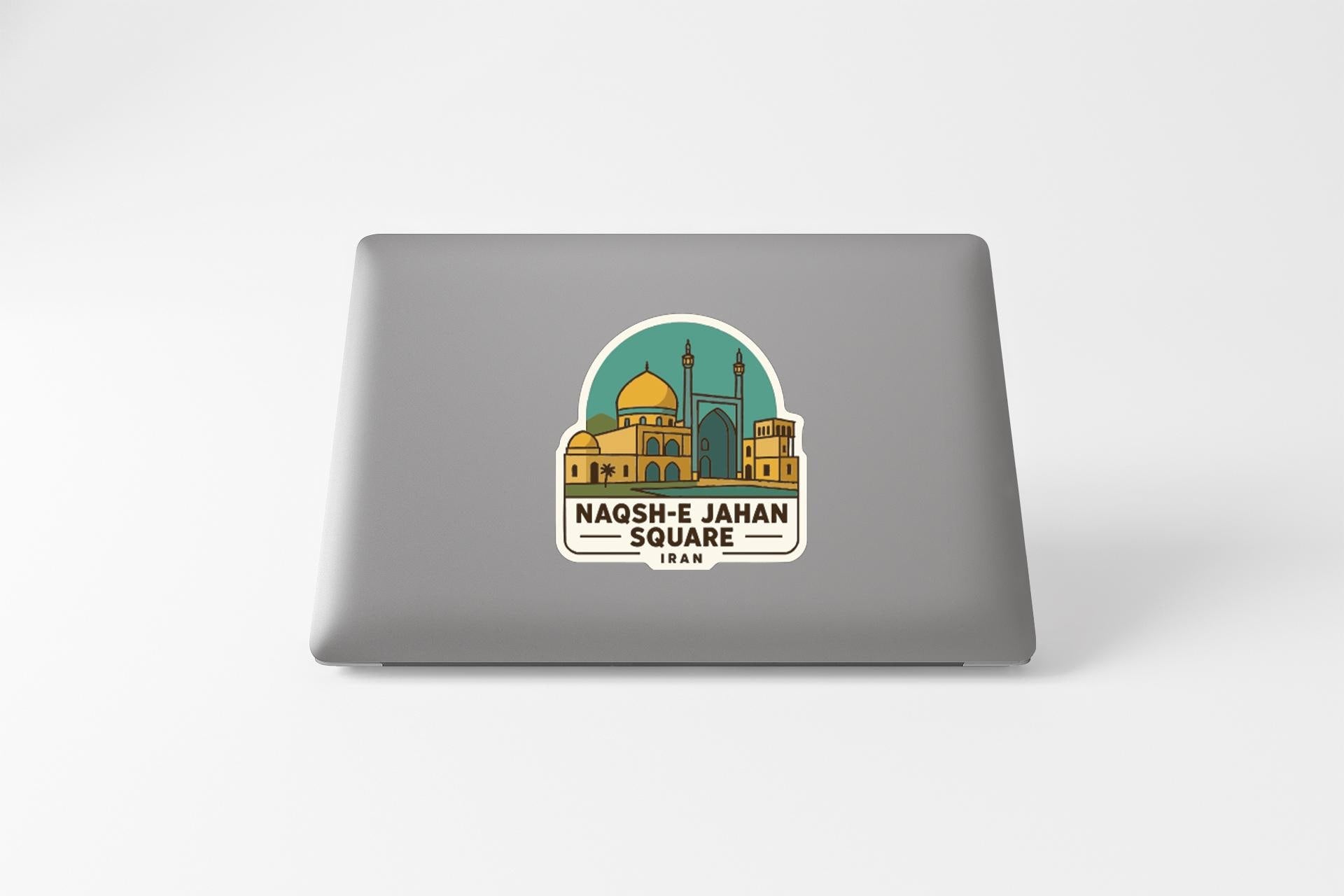 a sticker or decal on the back of a laptop, depicting a mosque with a dome and minaret.