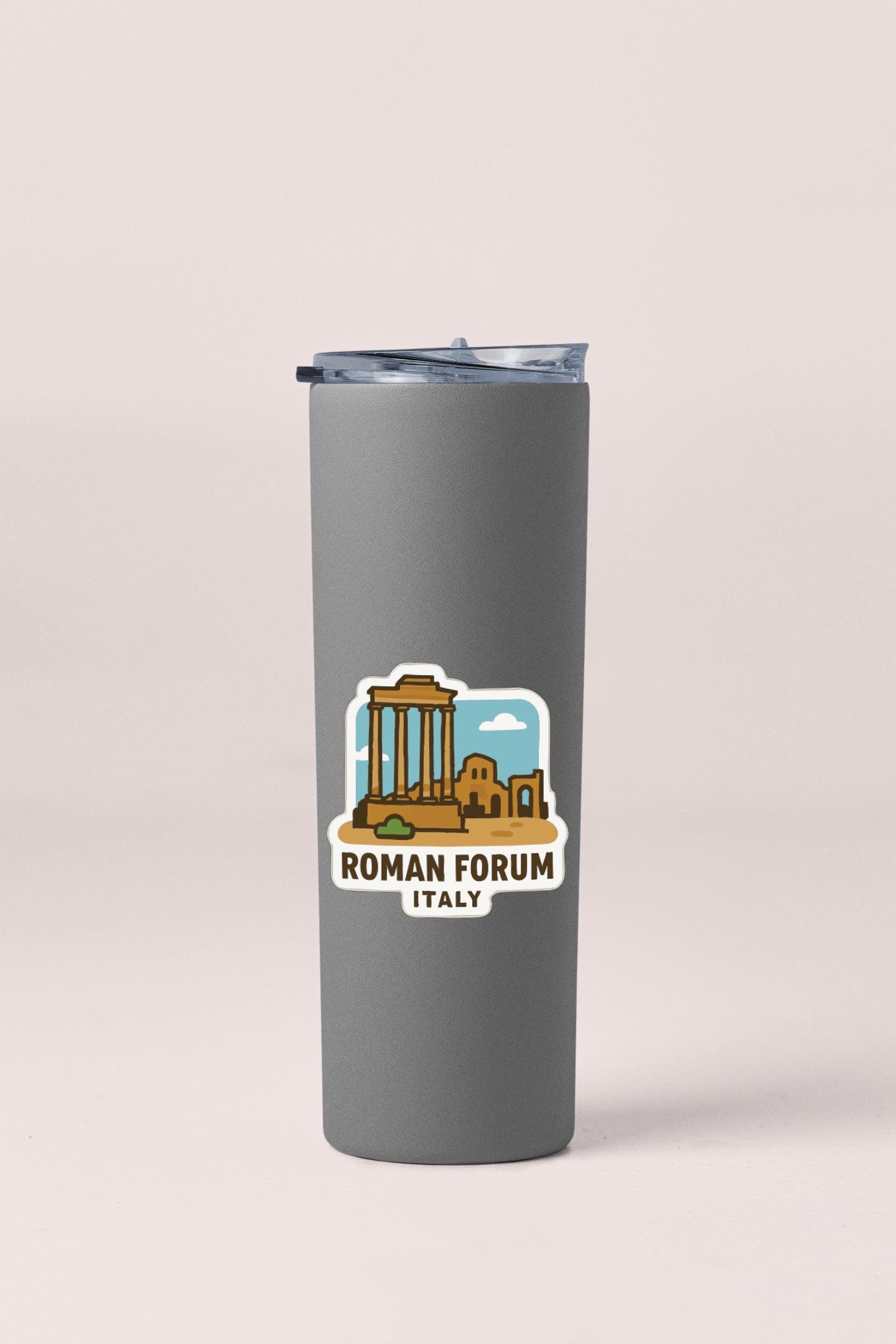 A gray tumbler with a sticker depicting the Roman Forum in Italy.