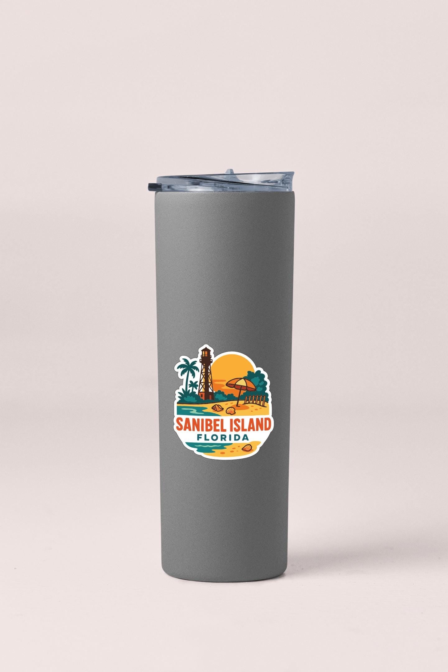A gray insulated tumbler with a sticker depicting the Sanibel Island in Florida.