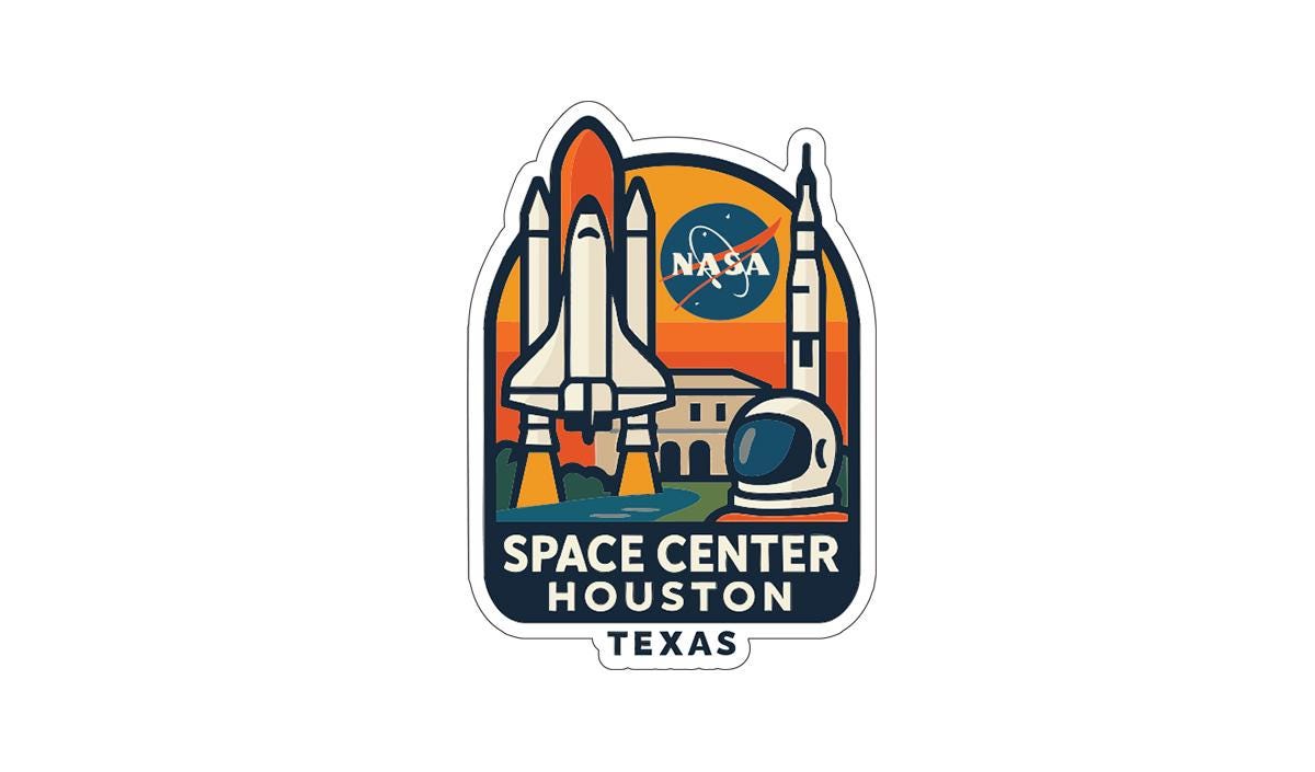 a sticker or emblem with the text "SPACE CENTER HOUSTON TEXAS" and various space-related icons, including a rocket launch and a space helmet.