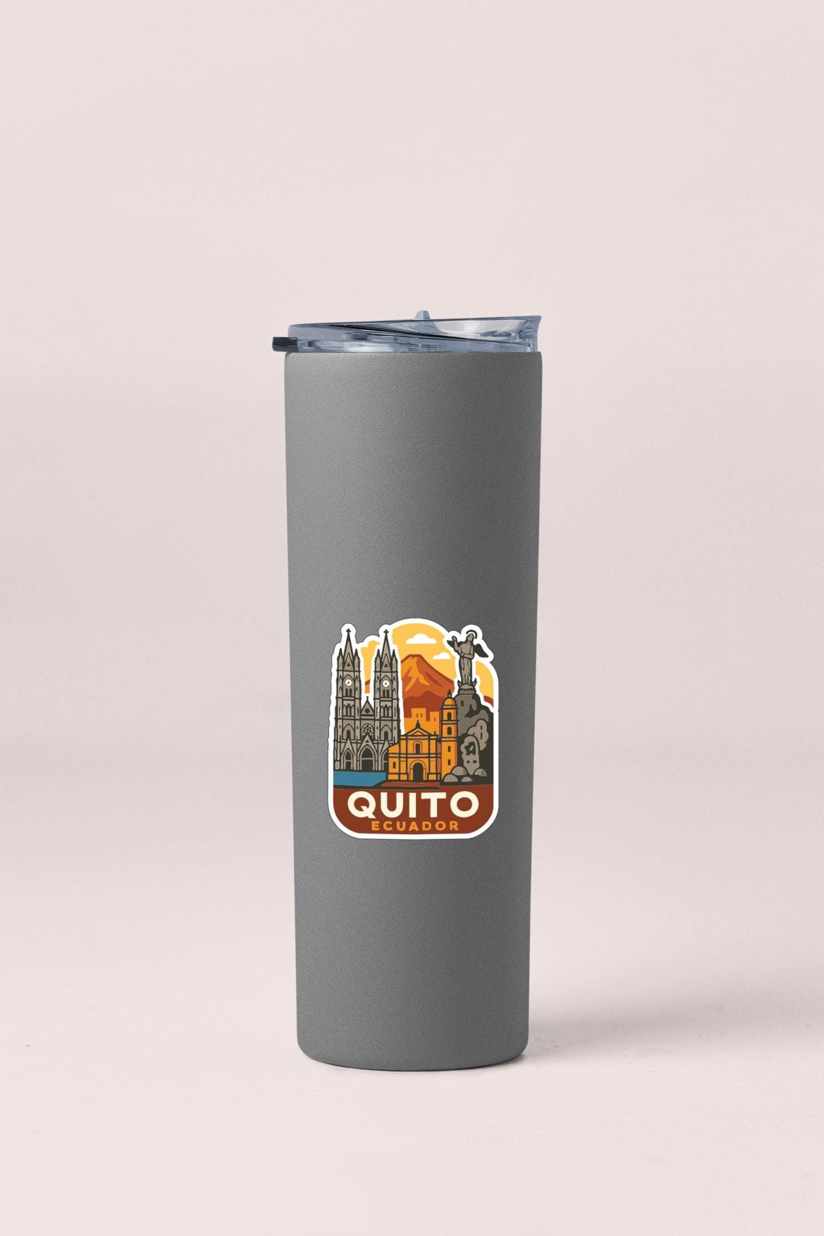 A gray insulated tumbler with a printed label featuring a cityscape and the text "QUITO ECUADO".