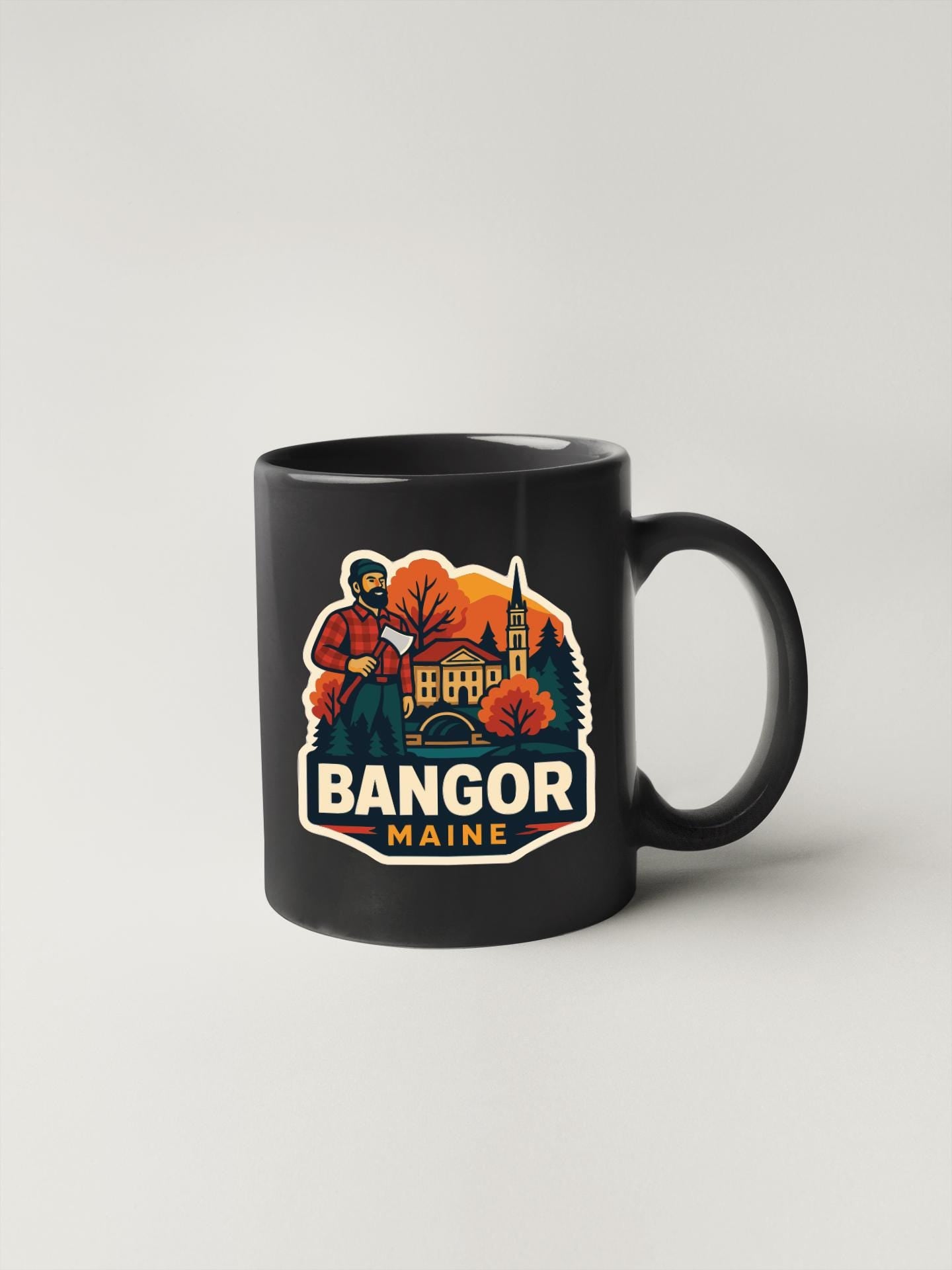 A black coffee mug with a graphic design featuring a man in a red jacket and the text "BANGOR MAINE" against a colorful background.