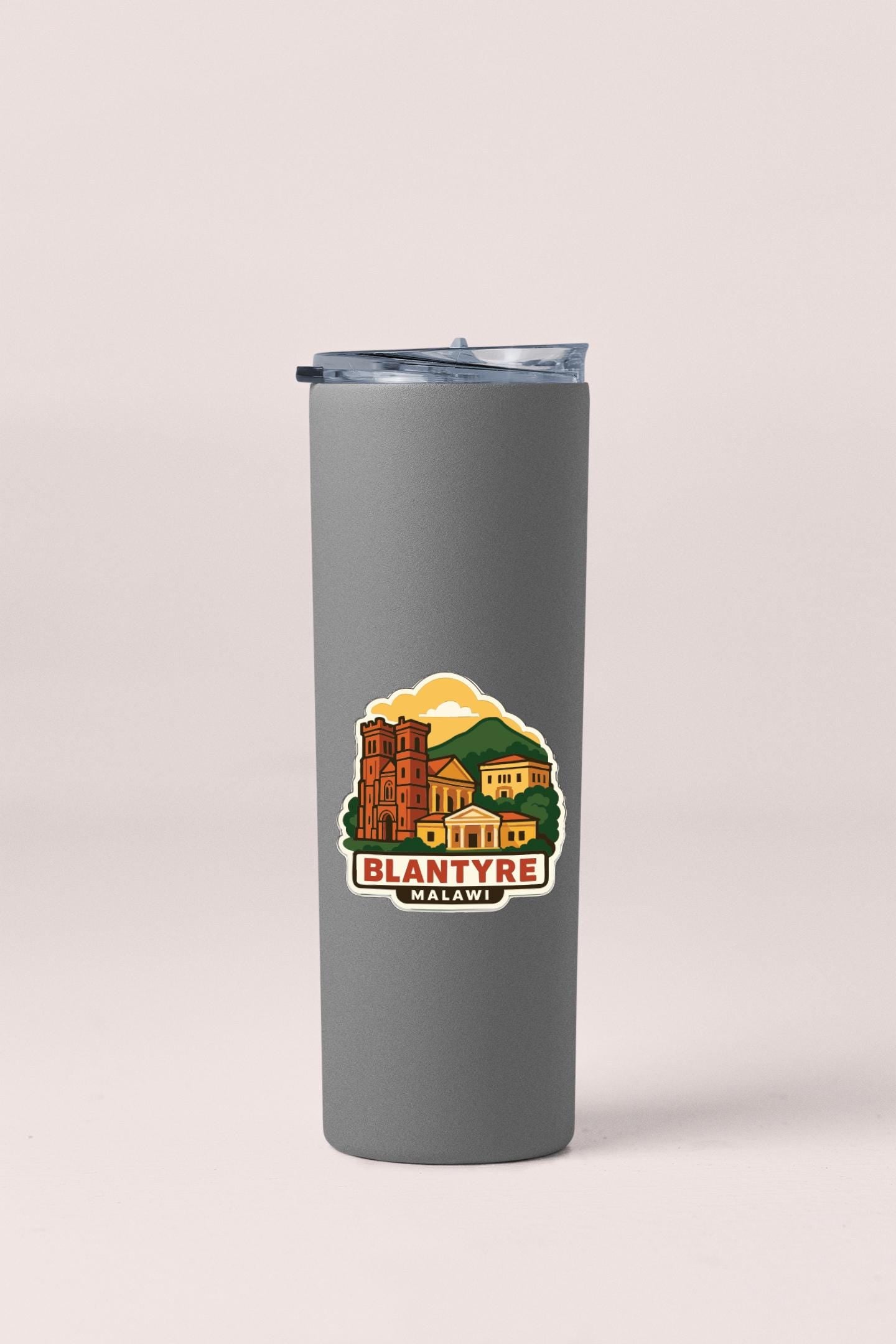 A gray insulated tumbler with a printed label that says "Blantyre Malawi".