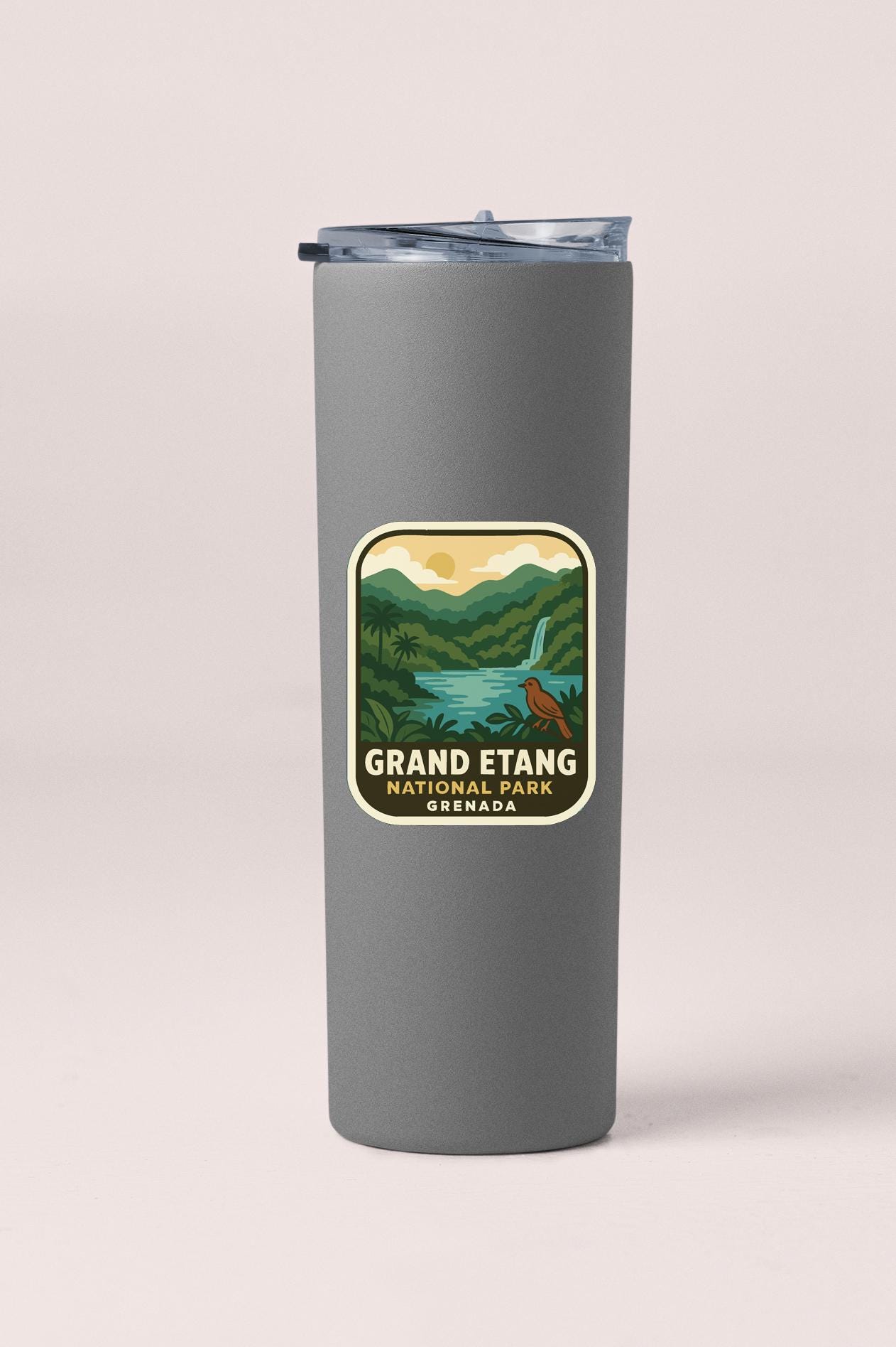 A gray tumbler with a label that says "GRAND ETANG NATURAL PARK GRENADA".