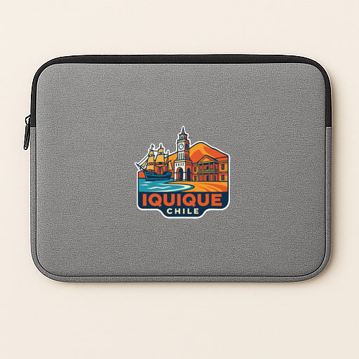 a gray laptop sleeve with a colorful graphic of Iquique, Chile, on it.