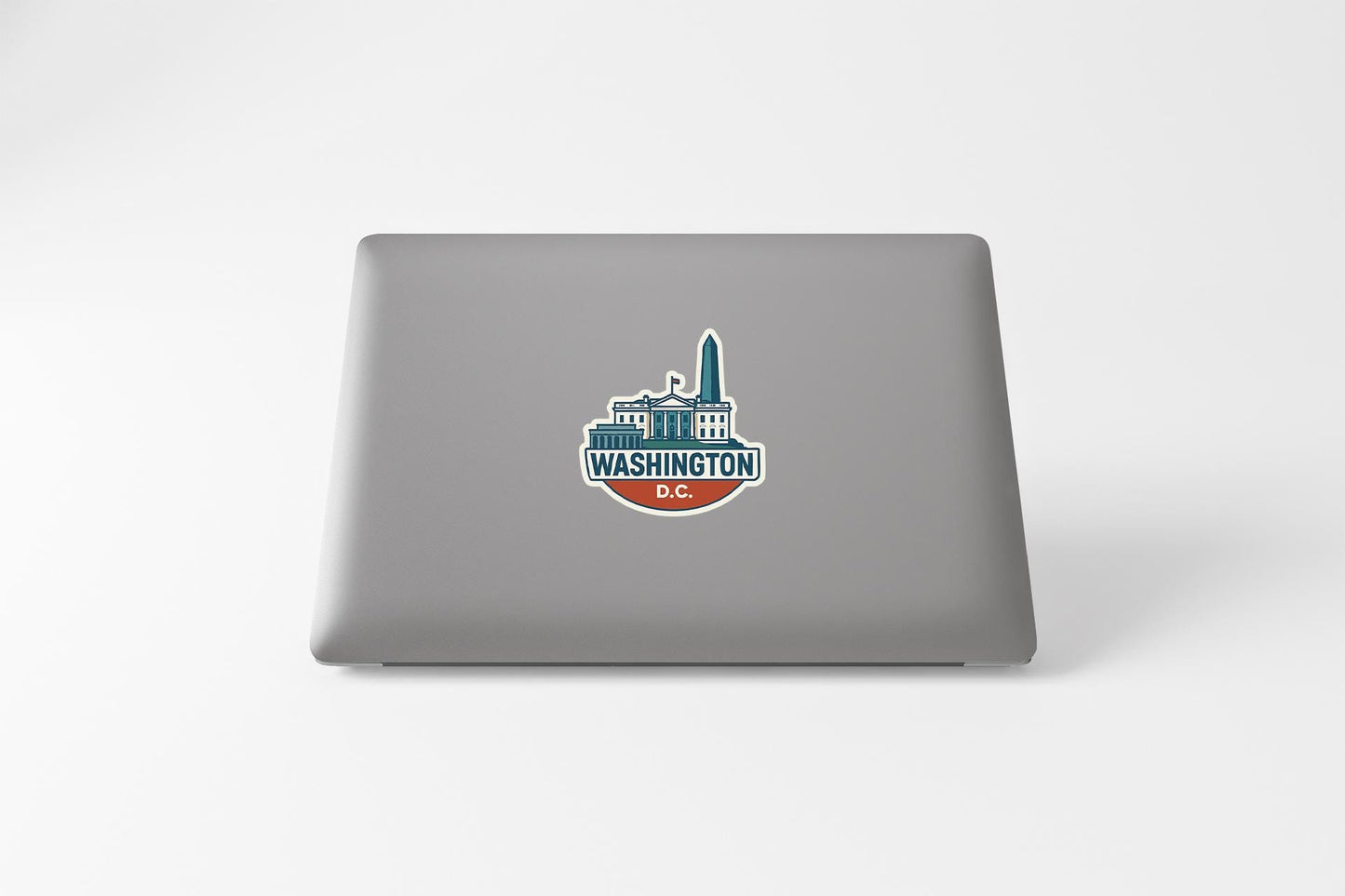 a laptop with a sticker of a washington d c skyline