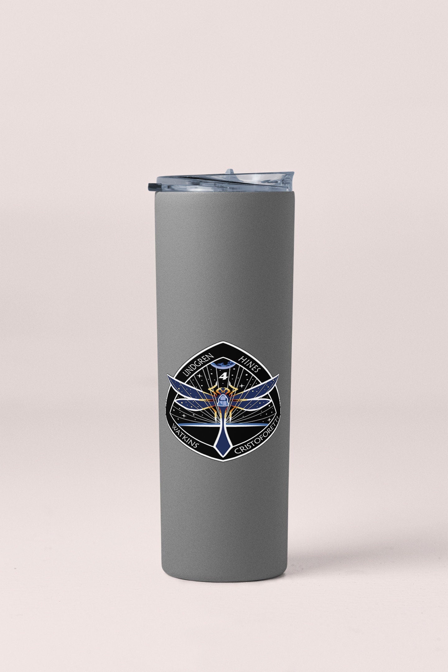 a stainless steel tumbler with a picture of a tree on it