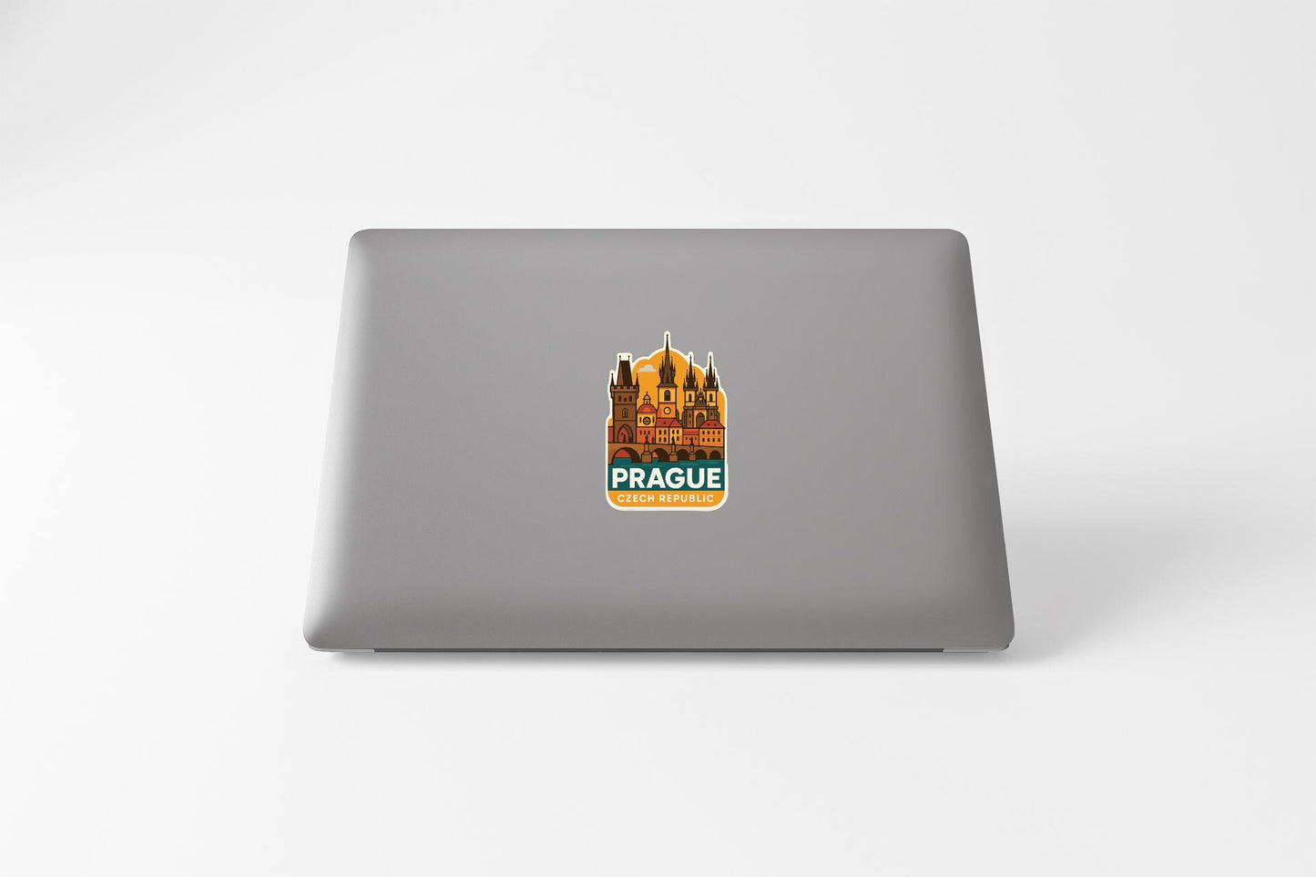 a sticker of Prague, Czech Republic, on the back of a laptop.