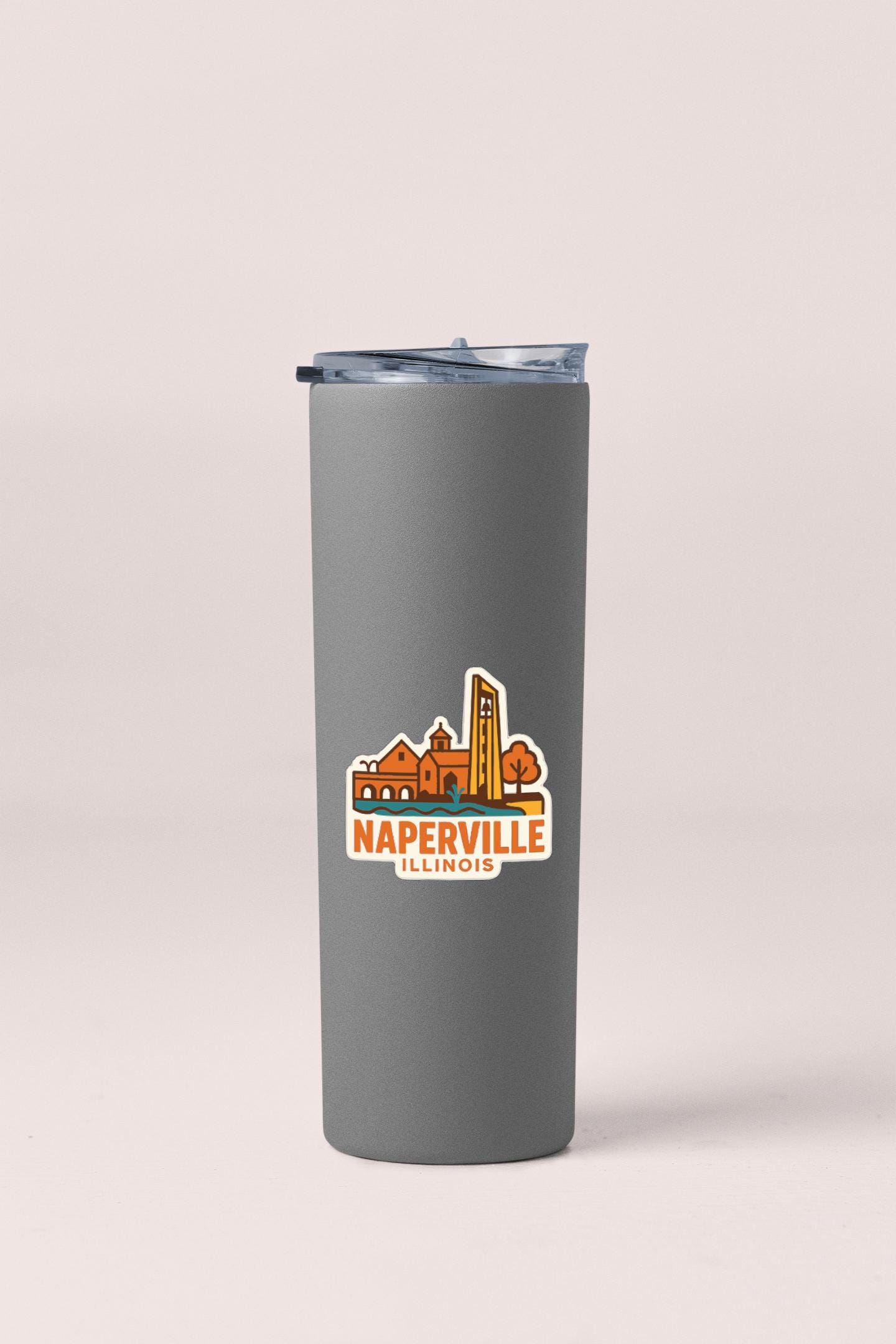 A gray insulated tumbler with a logo that says "NAPERVILLE ILLINOIS".