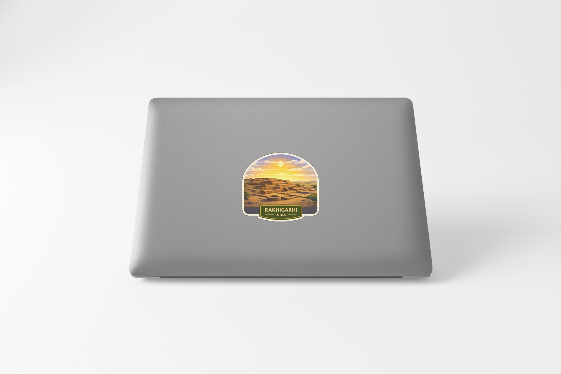 a sticker with a desert landscape on a laptop.