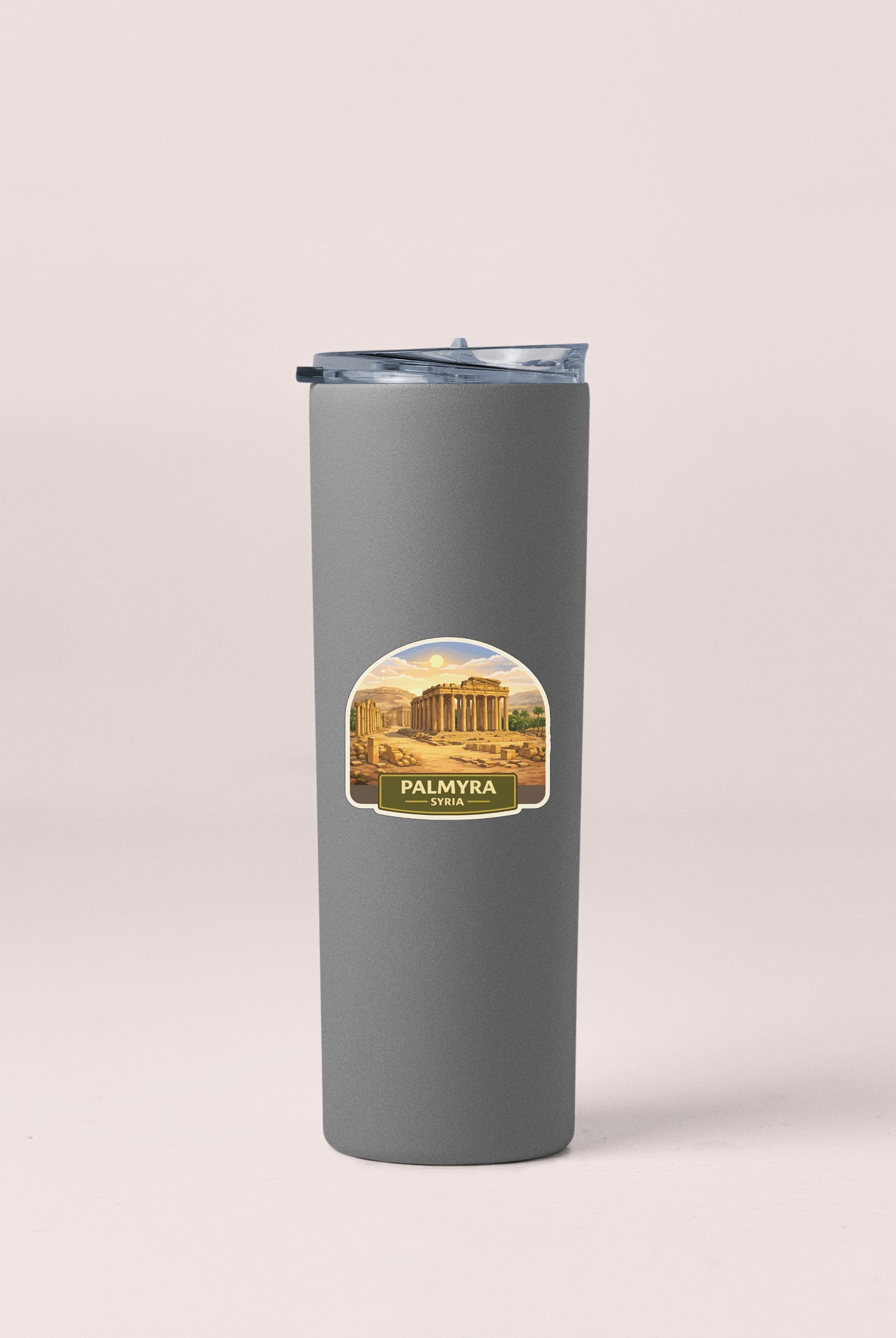 A gray insulated tumbler with a label that features an image of the Palace of Myrtos in Syria.