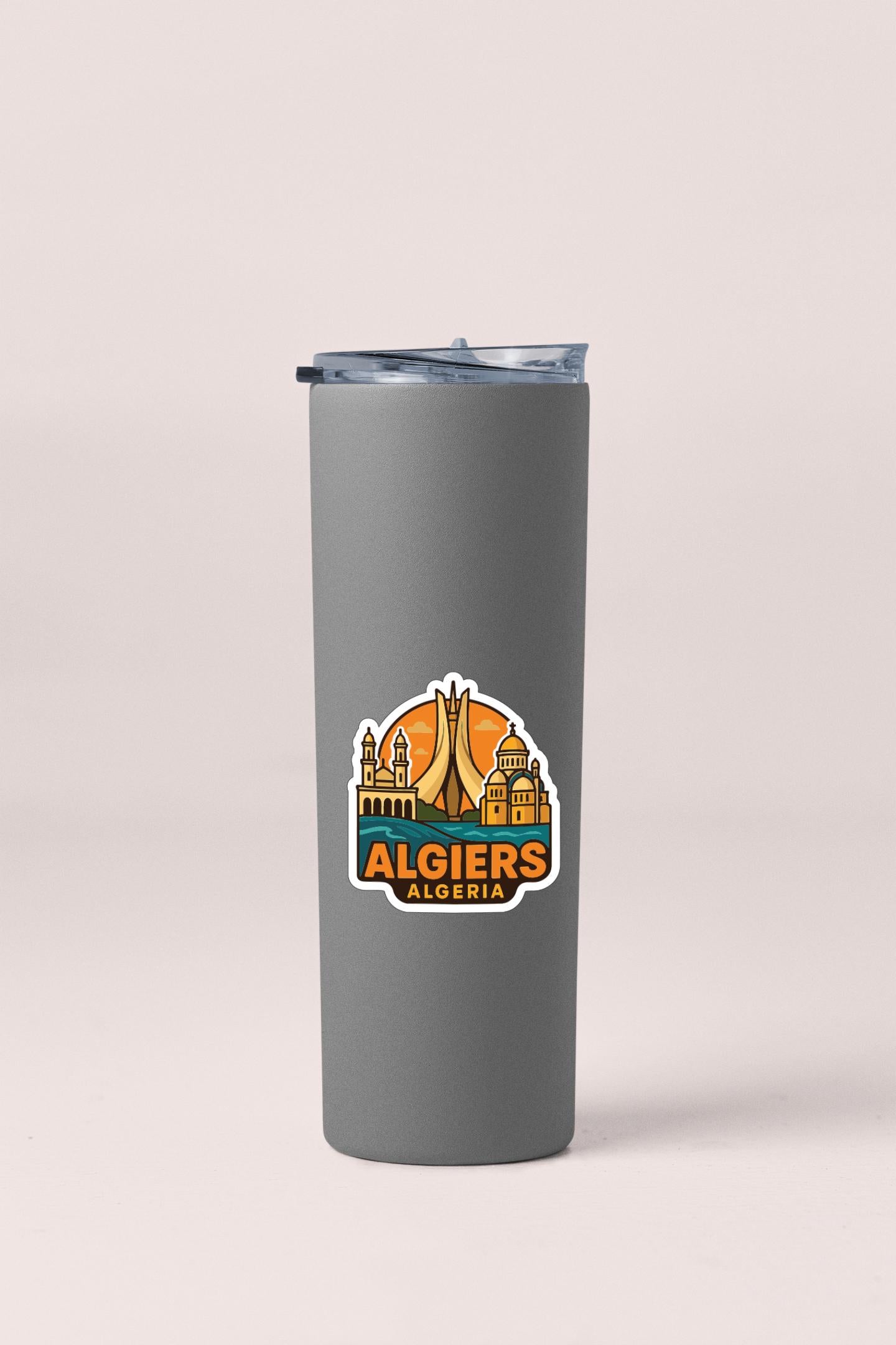A gray insulated tumbler with a sticker featuring the Algiers, Algeria logo.