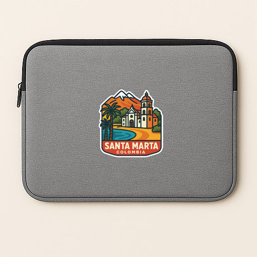 A gray laptop sleeve with a colorful sticker depicting Santa Marta, Colombia.
