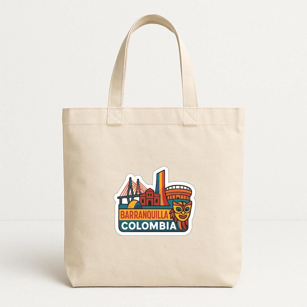 A beige tote bag with a colorful graphic depicting the city of Barranquilla, Colombia.