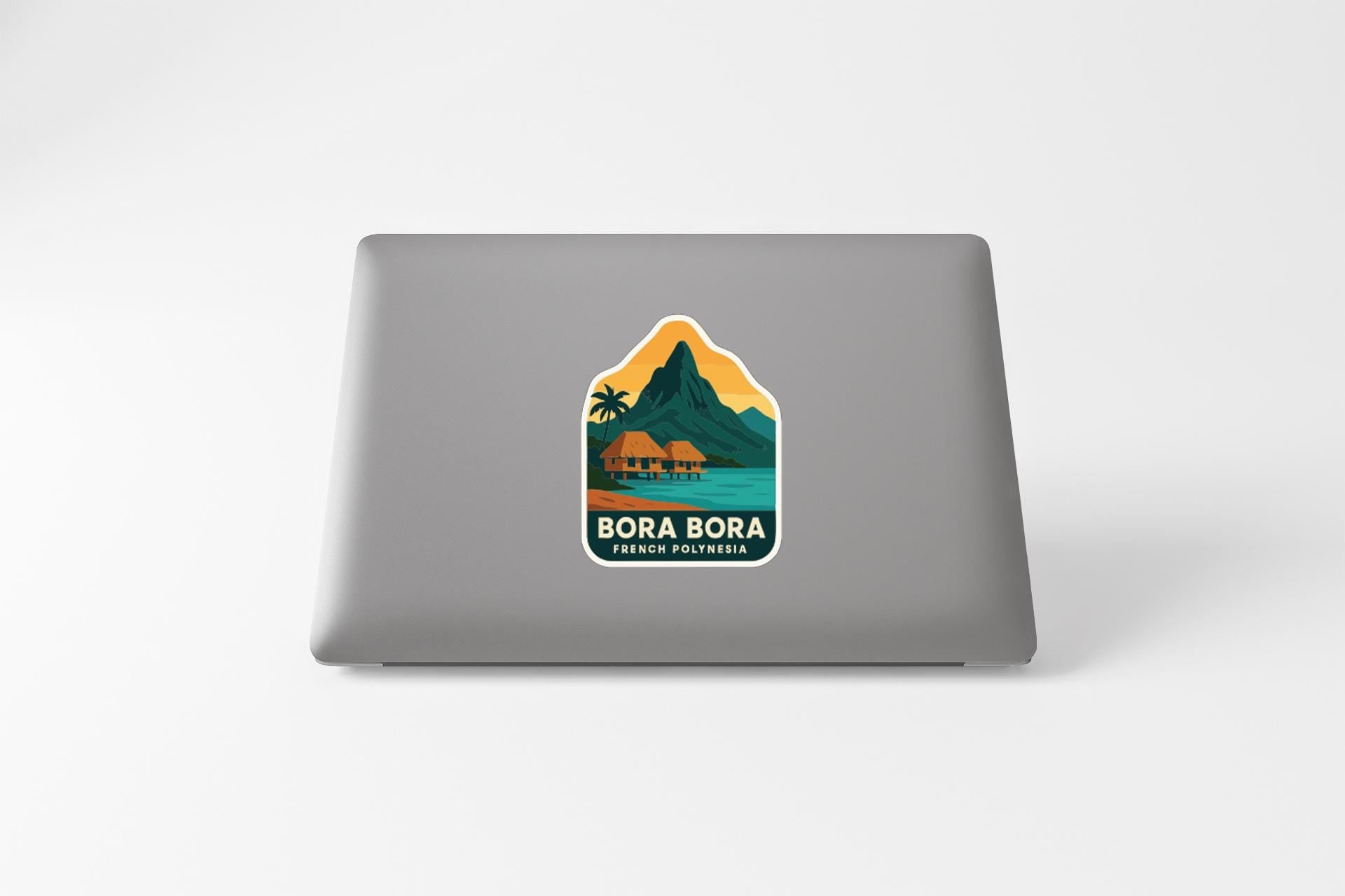 a sticker with a tropical island landscape and a mountain, along with the text "BORA BORA FRENCH PORTUGAL".