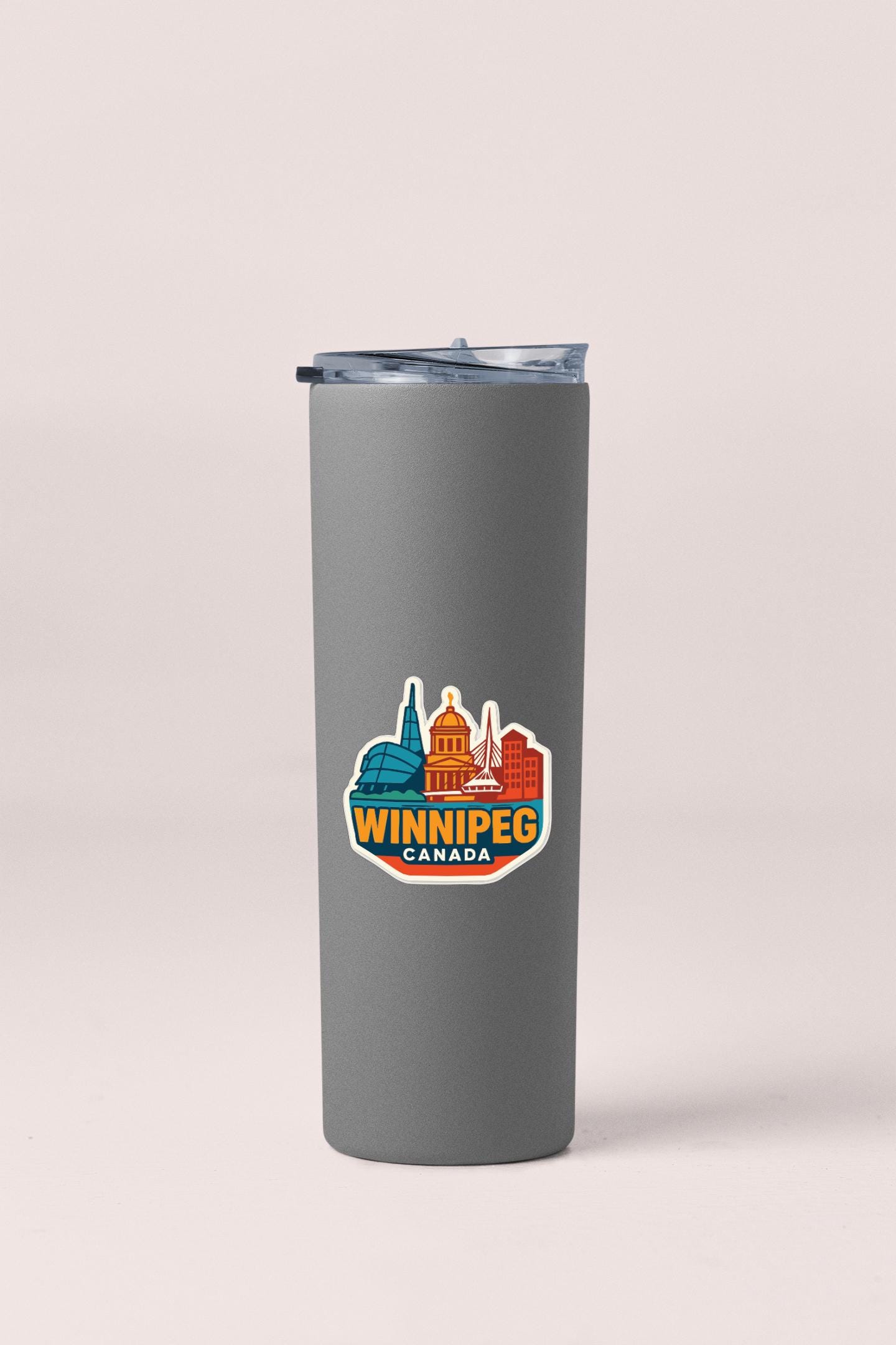 A gray insulated tumbler with a printed Winnipegg Canada logo on it.