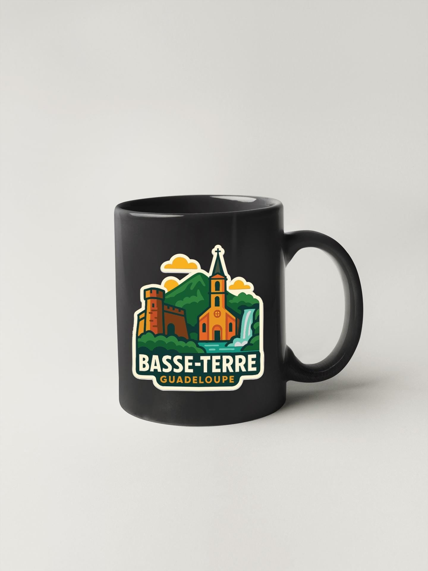 A black coffee mug with a graphic design featuring a castle, mountains, and a church.
