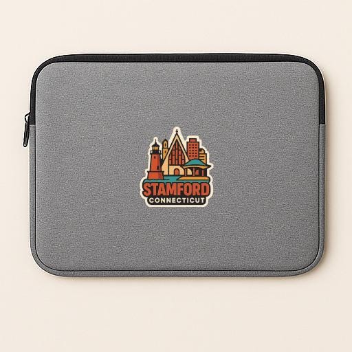 A gray laptop sleeve with a colorful sticker of the city of Stamford, Connecticut on it.