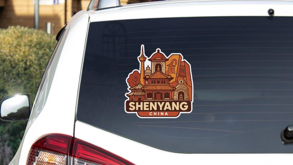 A sticker on the rear window of a car that features an illustration of a Chinese landmark, along with the text "SHENYANG CHINA".