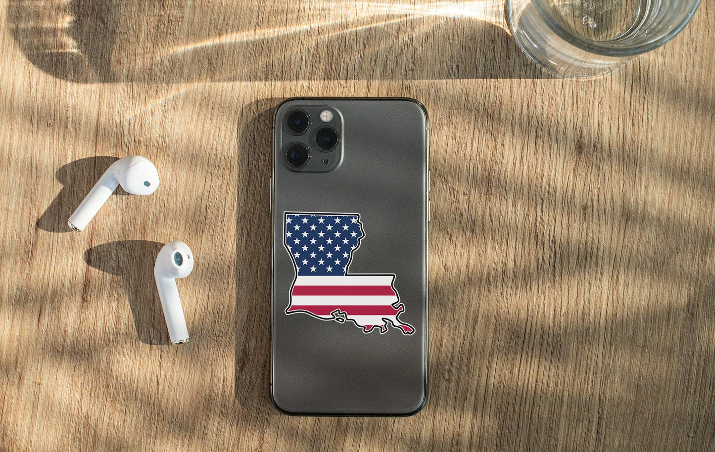 a cell phone with a sticker of the state of wisconsin on it