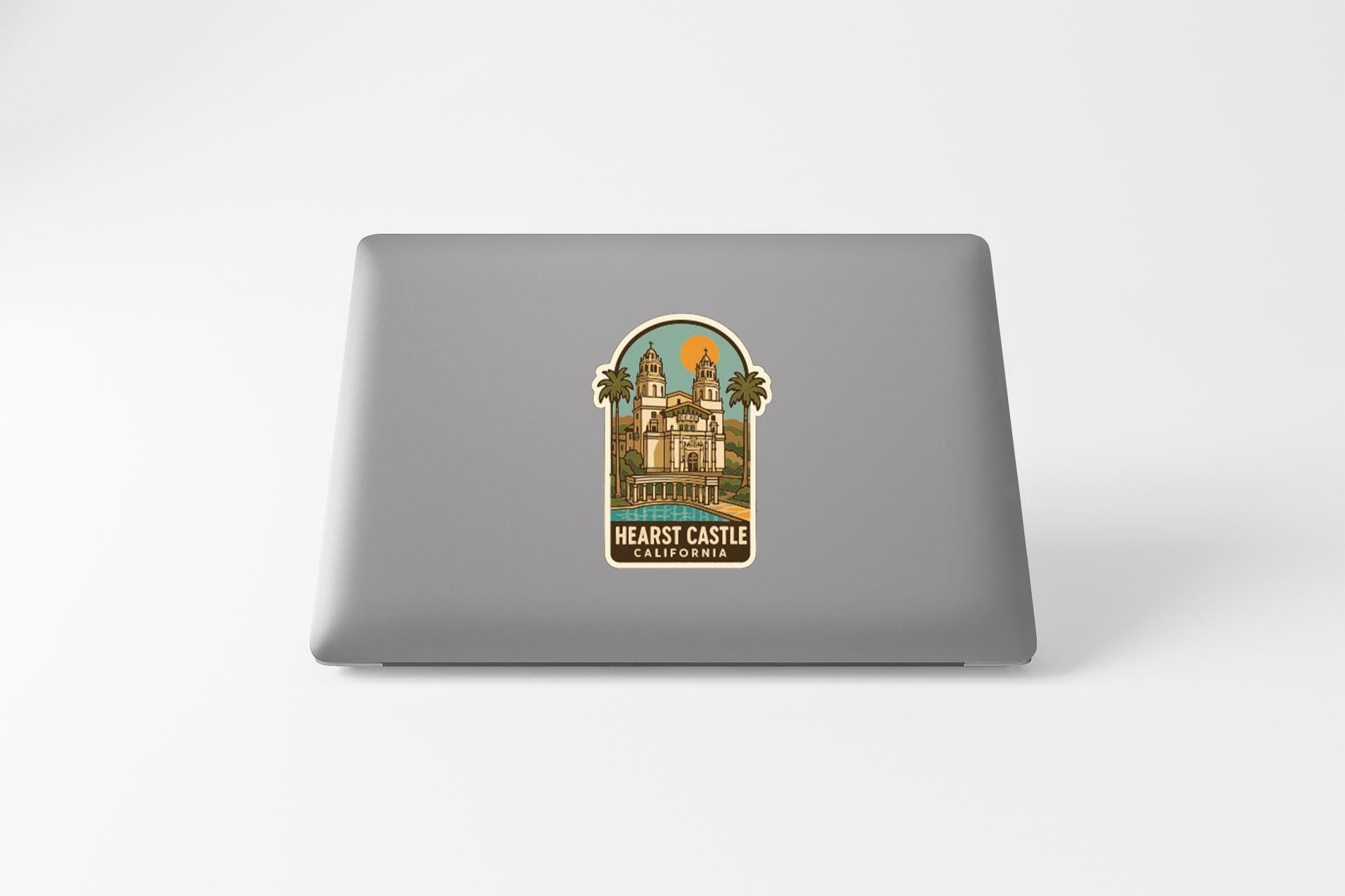 A sticker depicting a castle on a laptop.