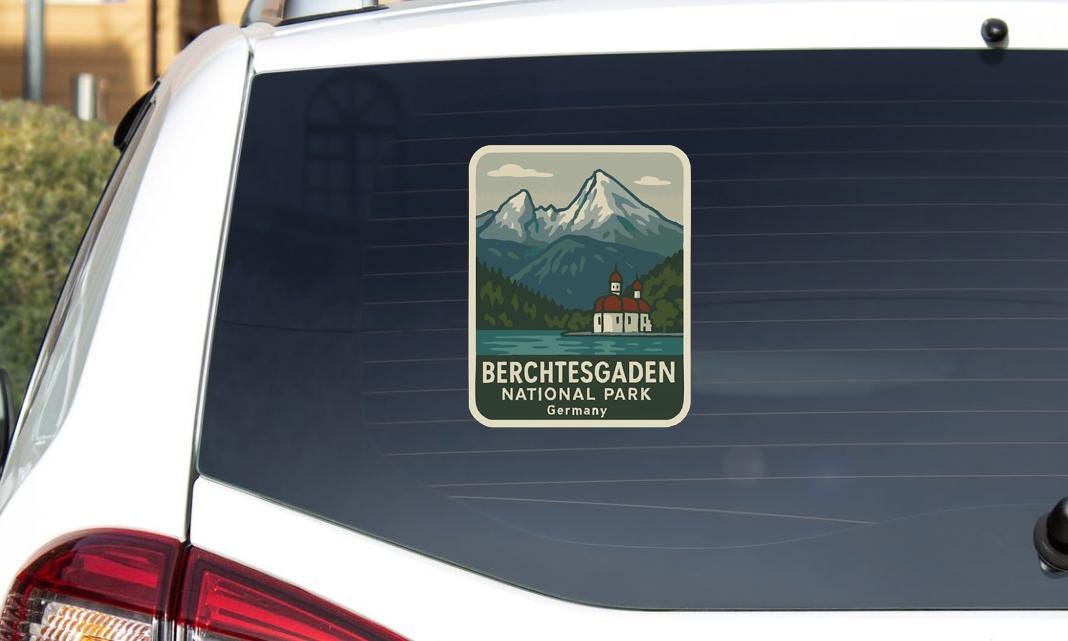A sticker on the rear window of a car that says "BERCHTESGADEN NATIONAL PARK GERMANY".