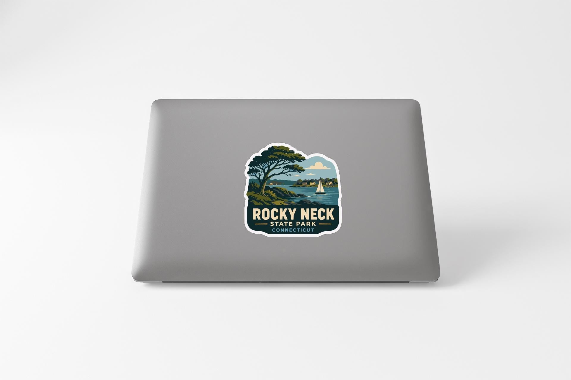 a sticker on the back of a laptop that says "ROCKY necks CONNECTICUT".