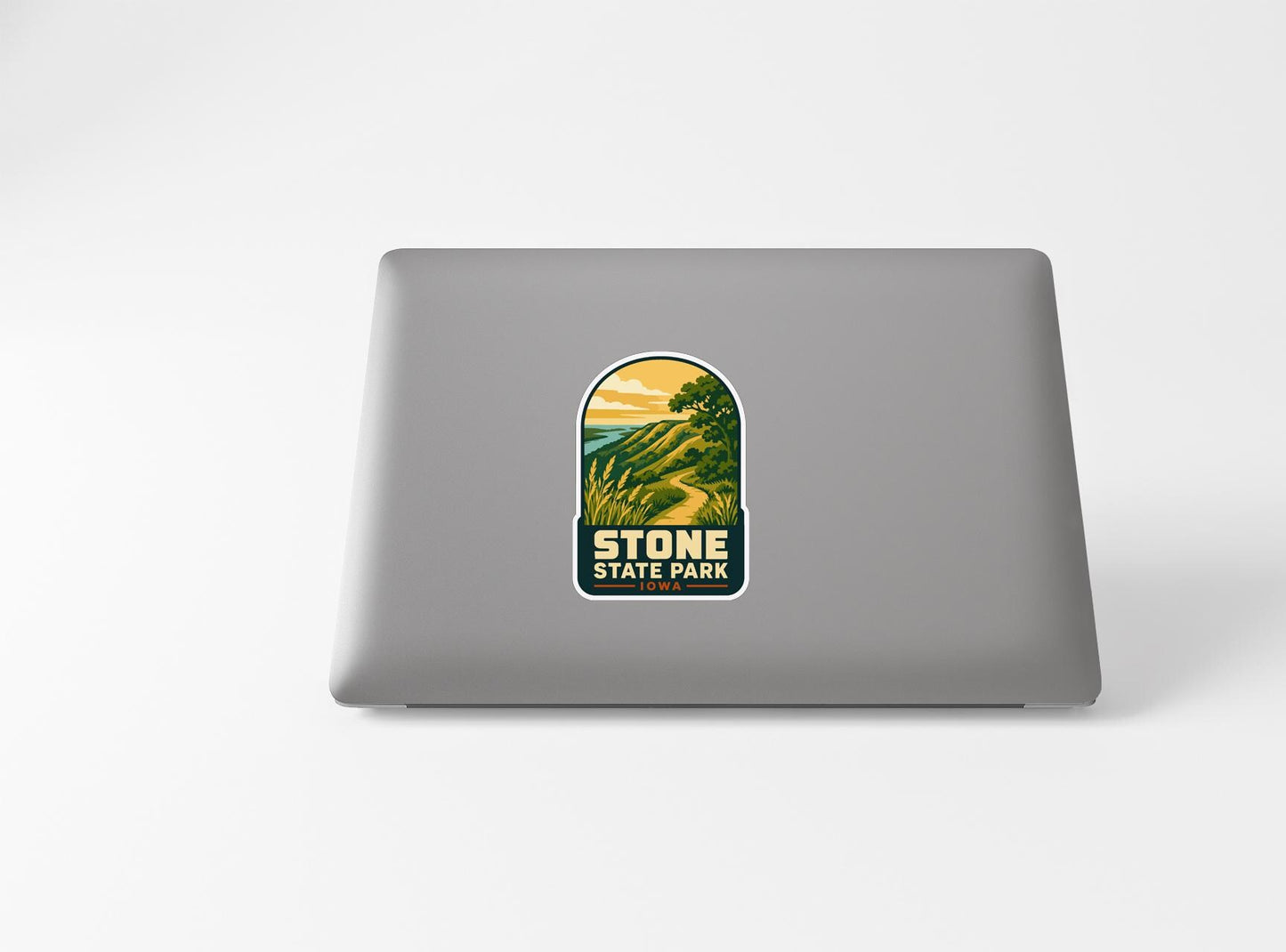 a sticker with a scenic landscape of a mountain and a lake, along with the text "STONE STATE PARK".