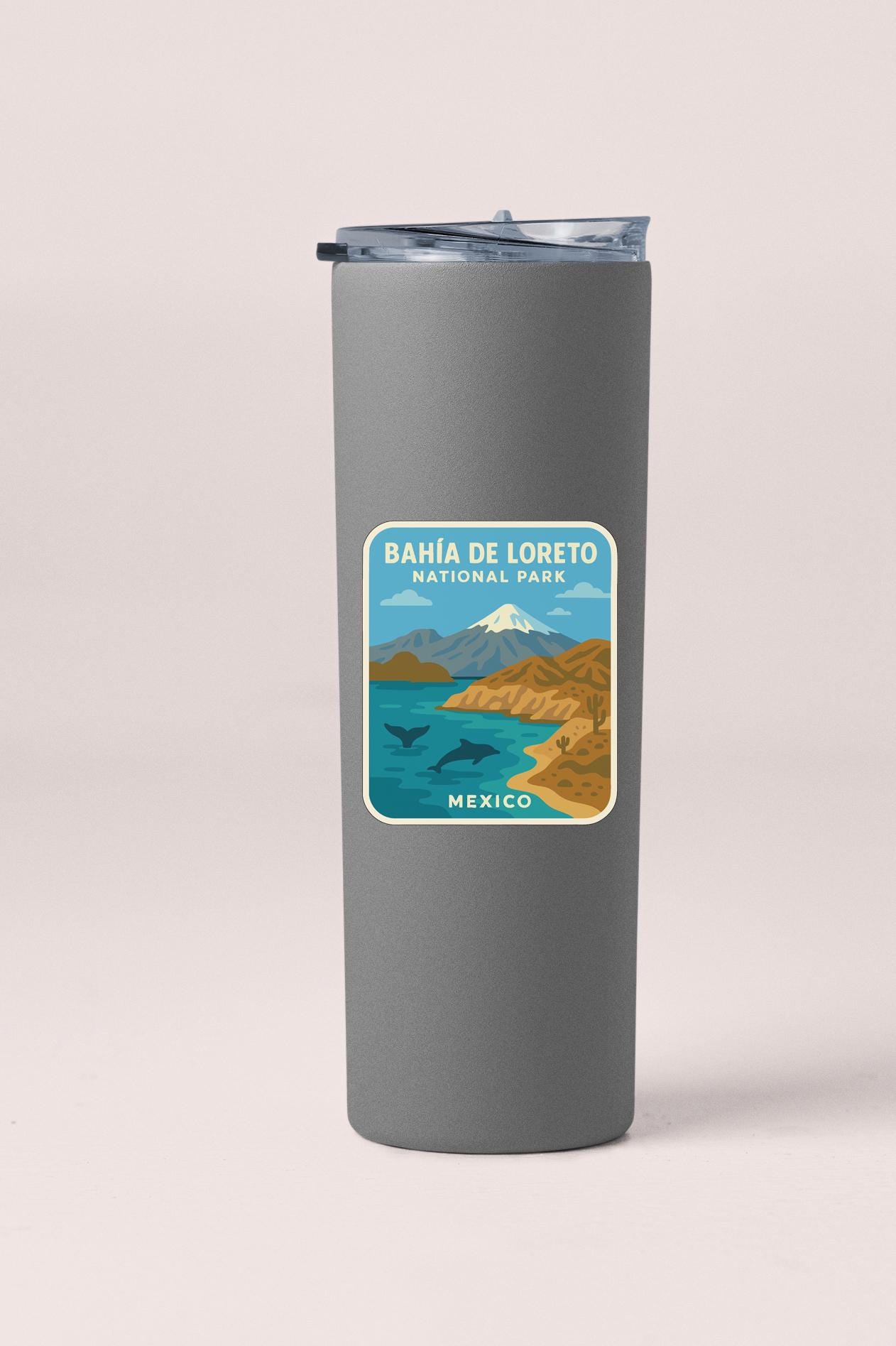 A gray insulated tumbler with a label that says "BAHIA DE LORETO NATIONAL PARK MEXICO".
