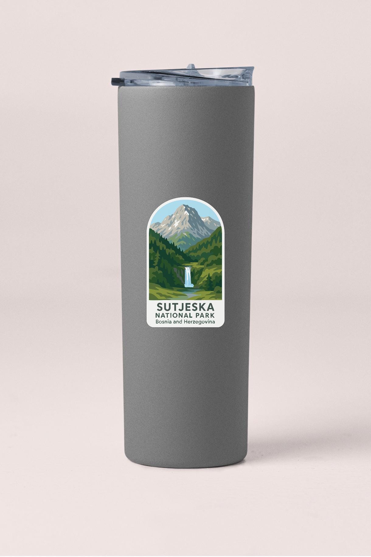A gray insulated tumbler with a label that says "SUTJESKA NATIONAL PARK BOSIA AND HERZOGOVINA".