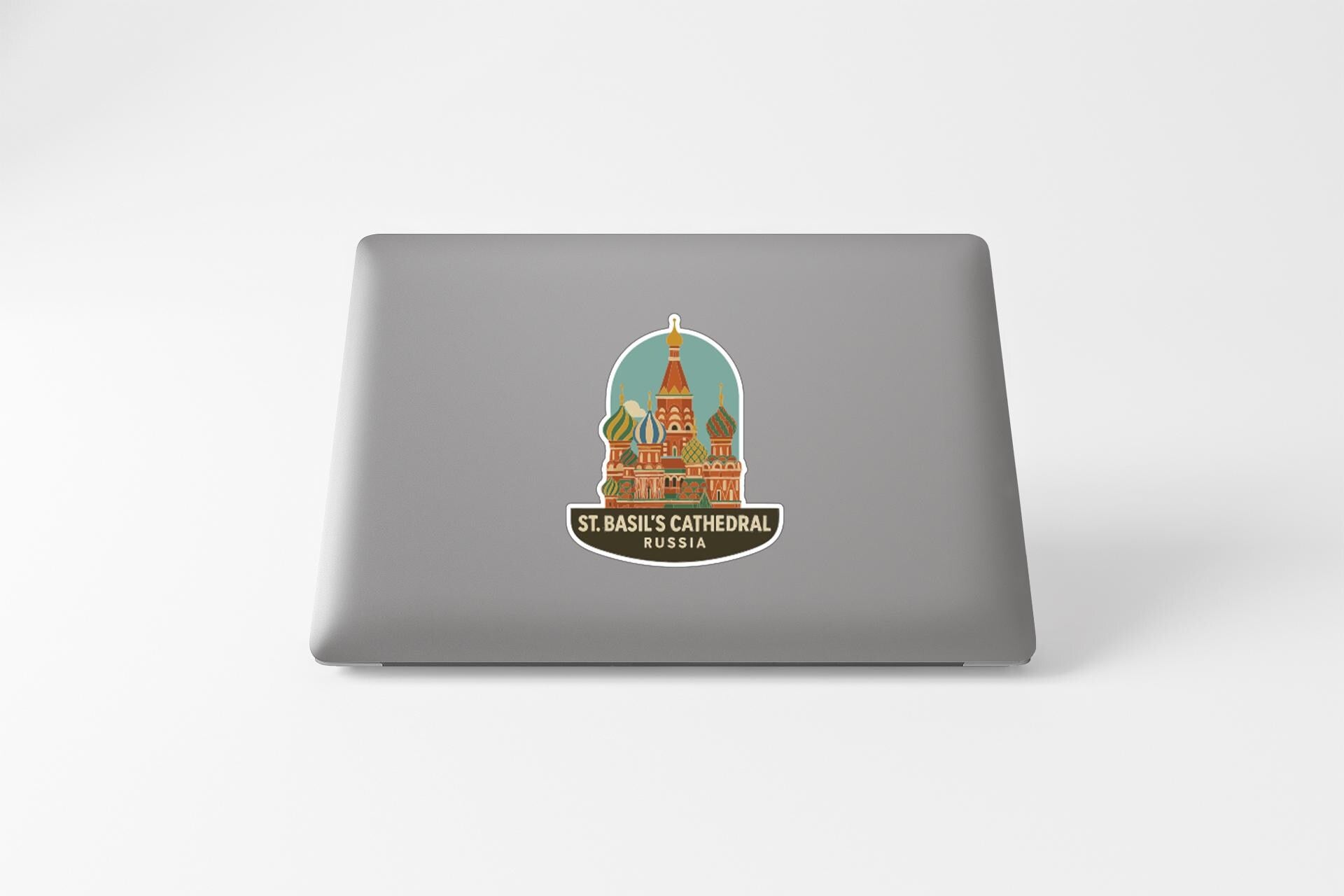 a sticker or decal of St. Basil's Cathedral in Russia on the back of a laptop.