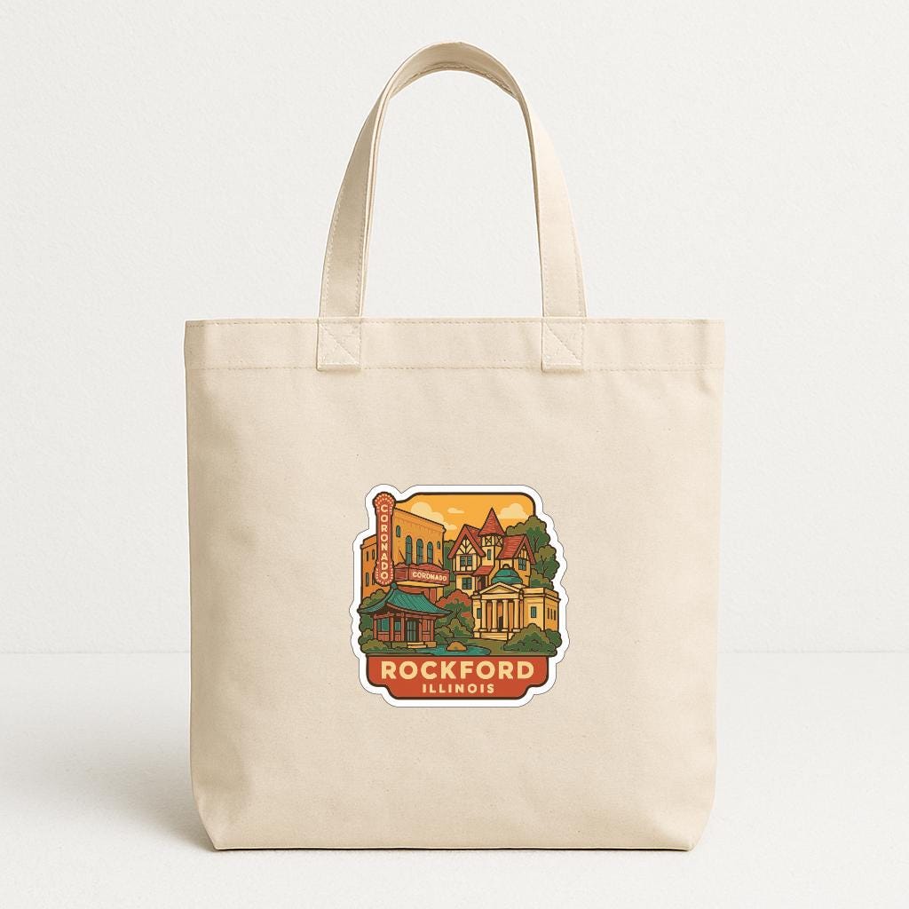 A beige tote bag with a printed sticker depicting a scenic view of Rockford, Illinois.