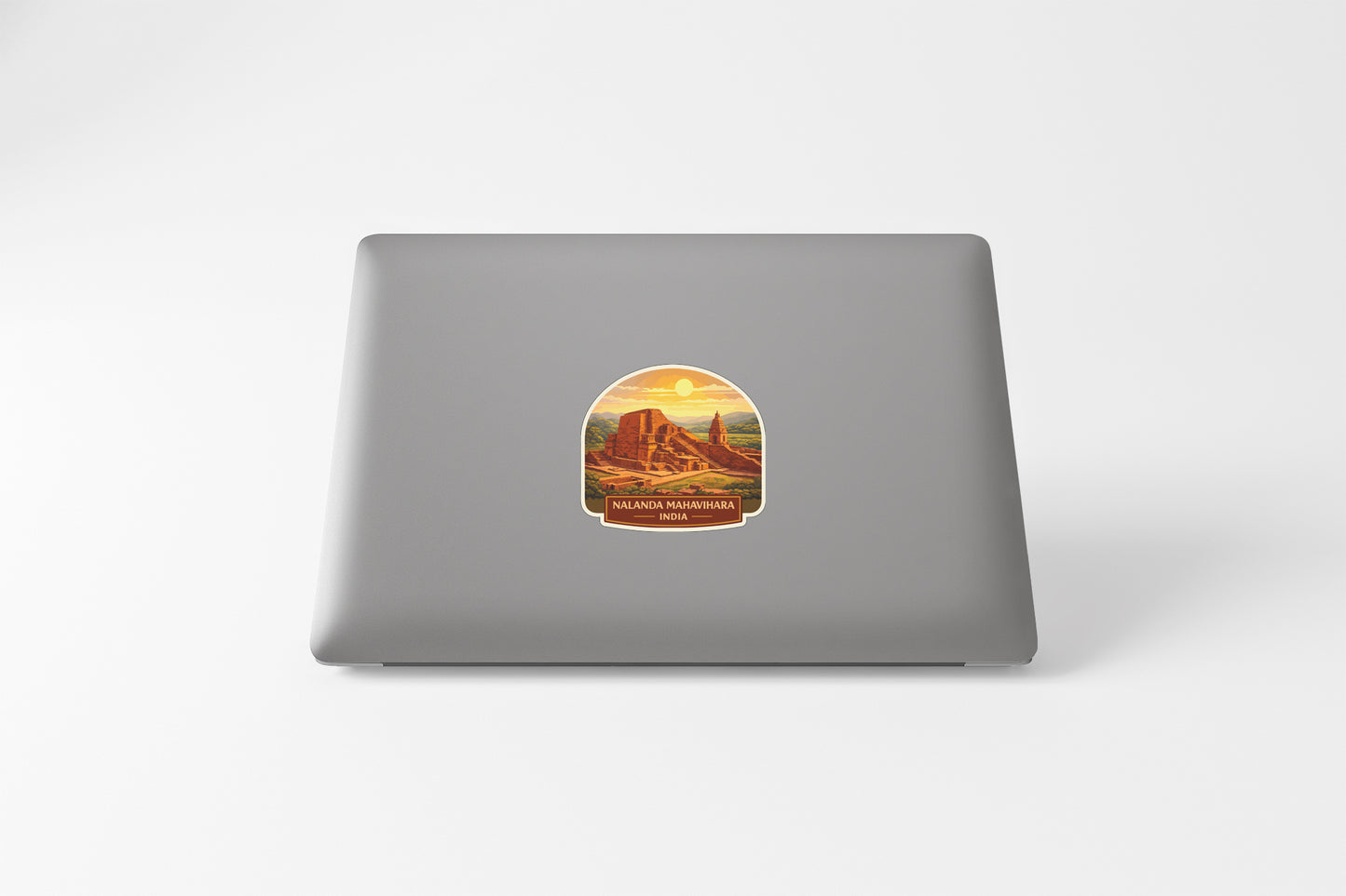 A sticker depicting a desert landscape with a mountain in the background.
