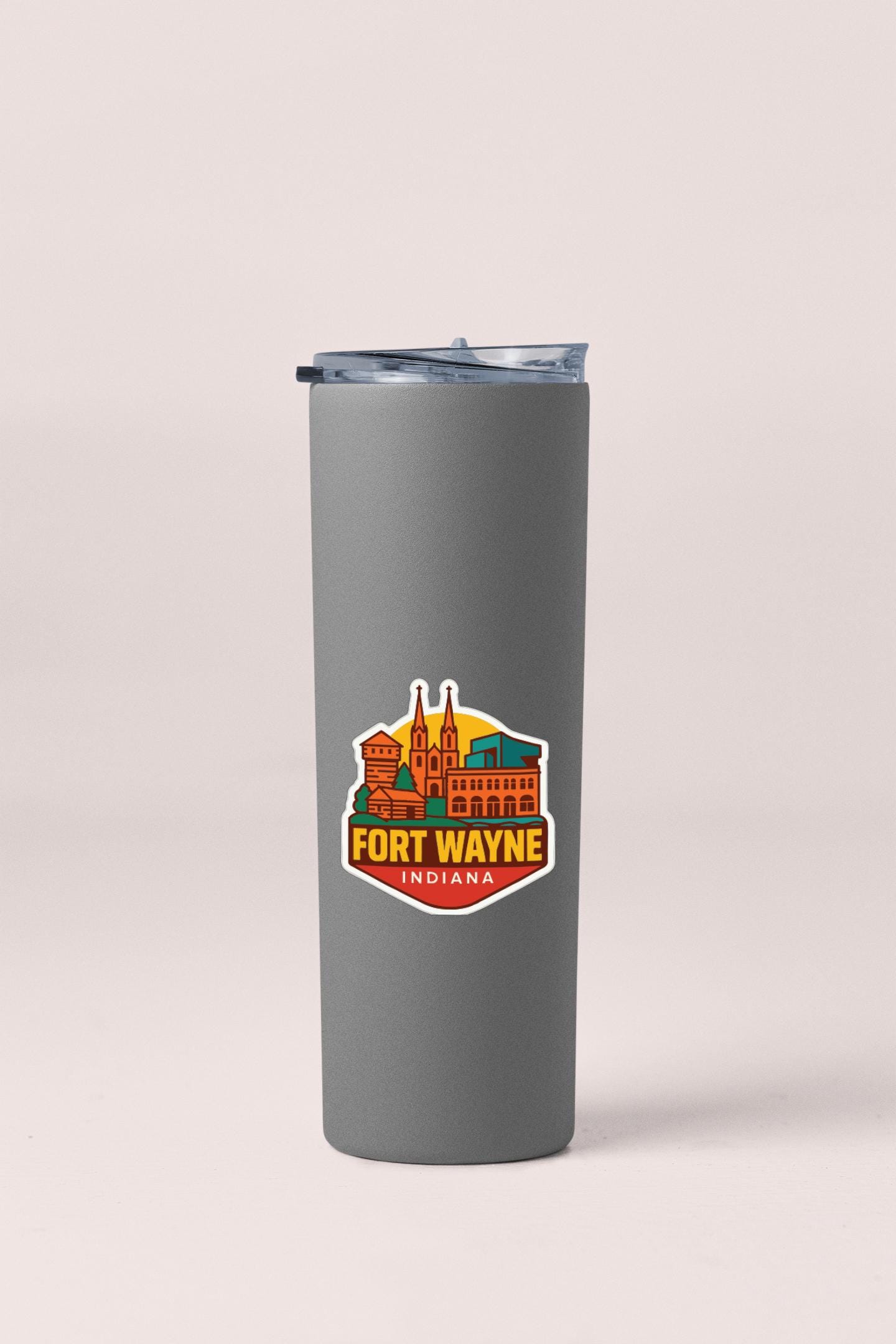 A gray insulated tumbler with a logo that says "Fort Wayne Indiana" on it.