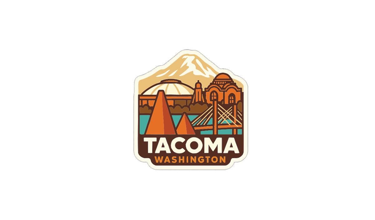 A sticker or logo featuring the city of Tacoma, Washington, with a mountain in the background and a bridge in the foreground.