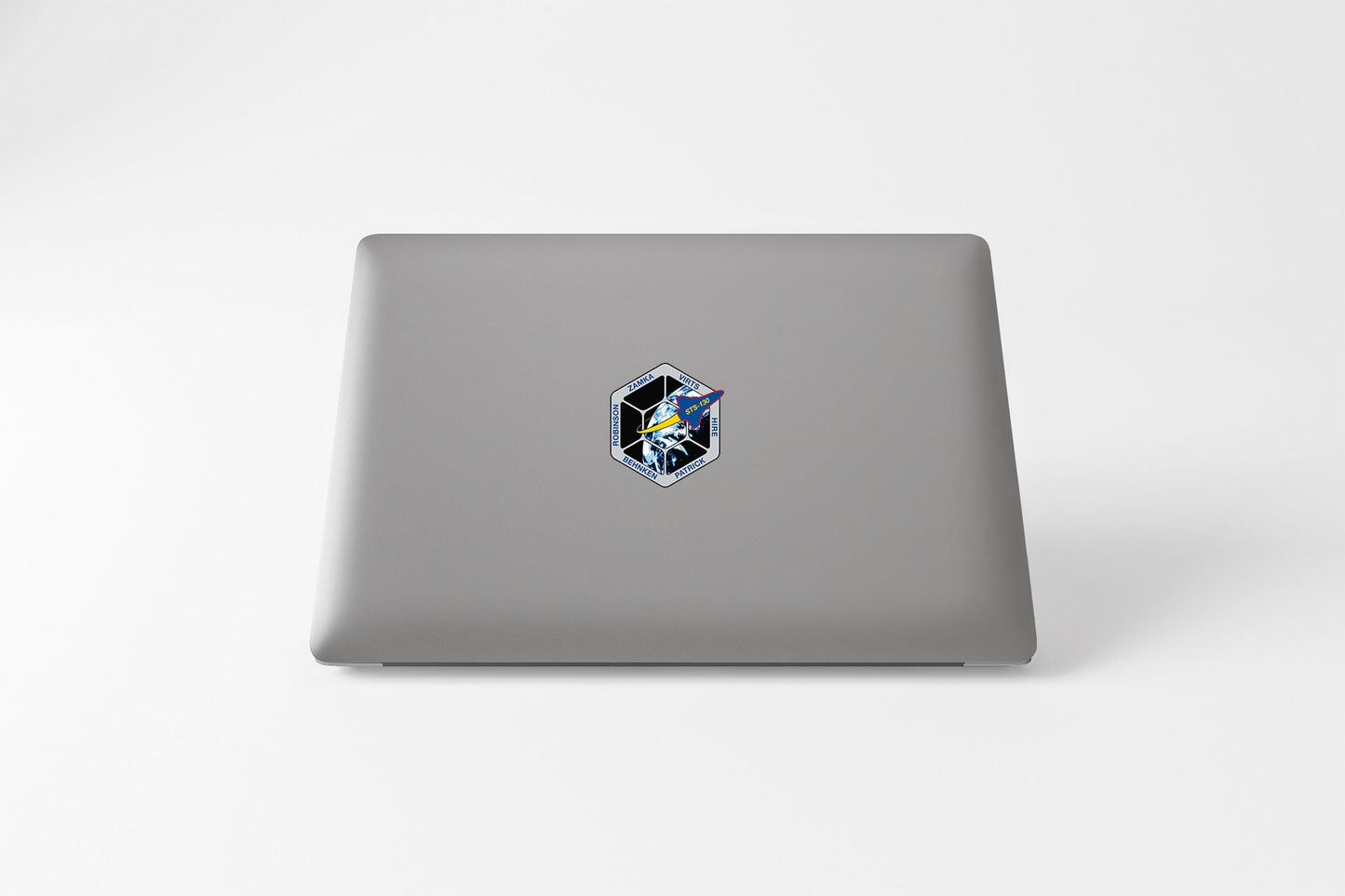a laptop computer sitting on top of a white table