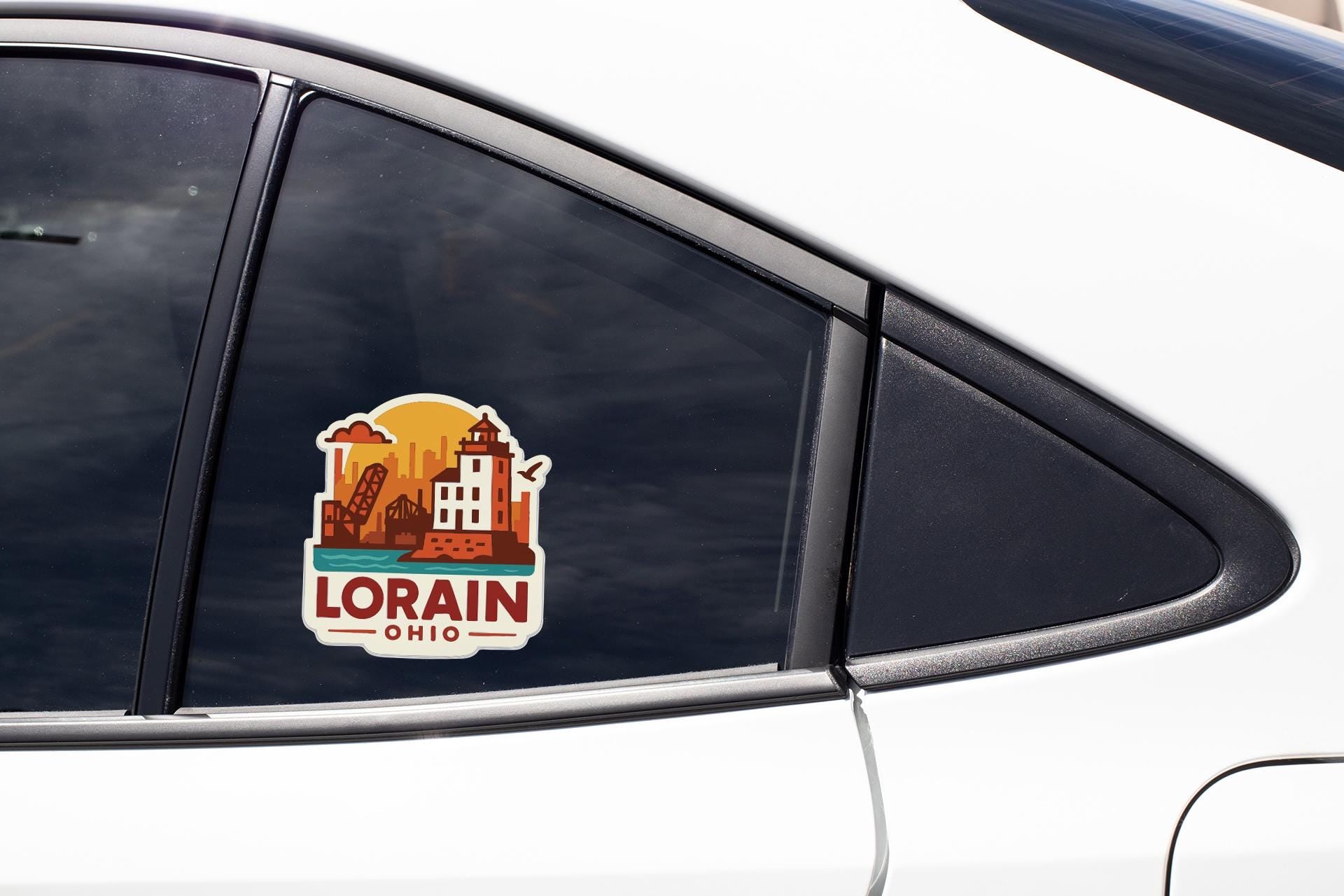 A sticker on the side of a car window, depicting a cityscape with a building and a sun.