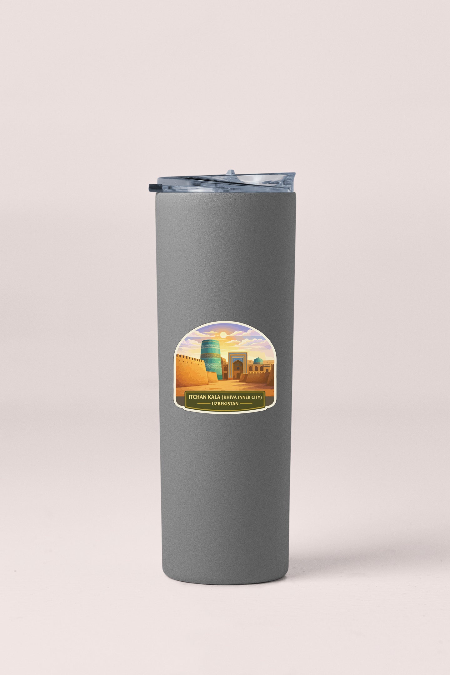A gray cylindrical container with a lid and a sticker depicting a cityscape.