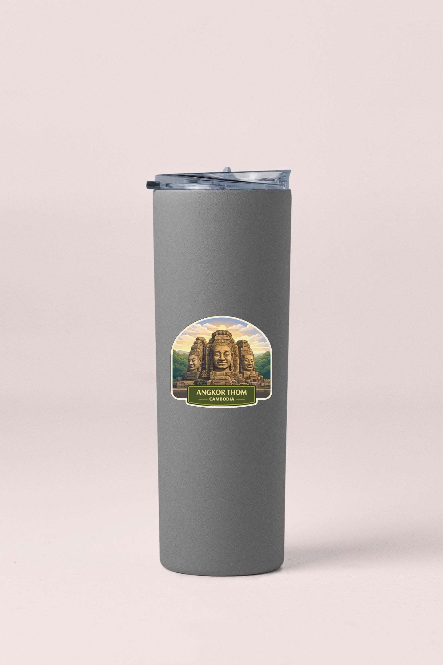 A gray tumbler with a label that features an image of the Angkor Thom temple in Cambodia.