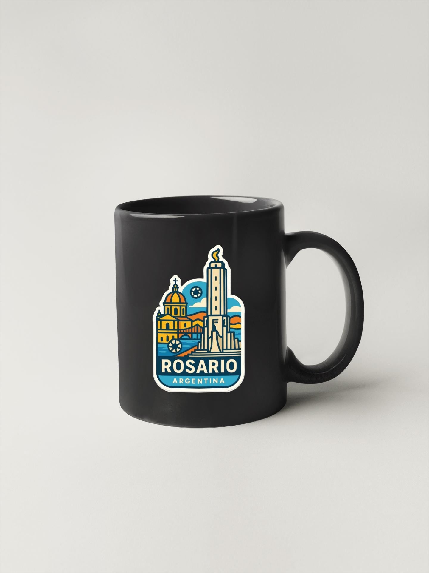 A black coffee mug with a colorful graphic design depicting the city of Rosario, Argentina.