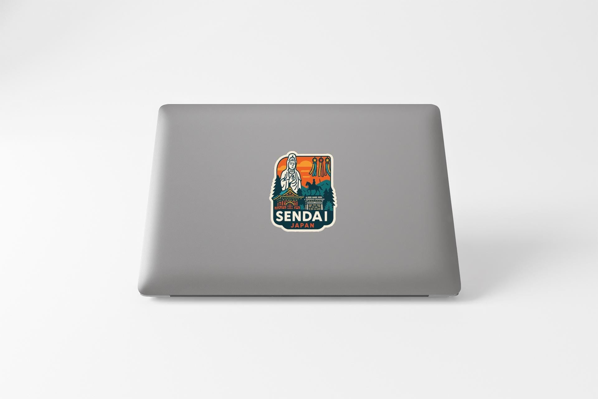 a sticker on the back of a laptop with a colorful design and text.