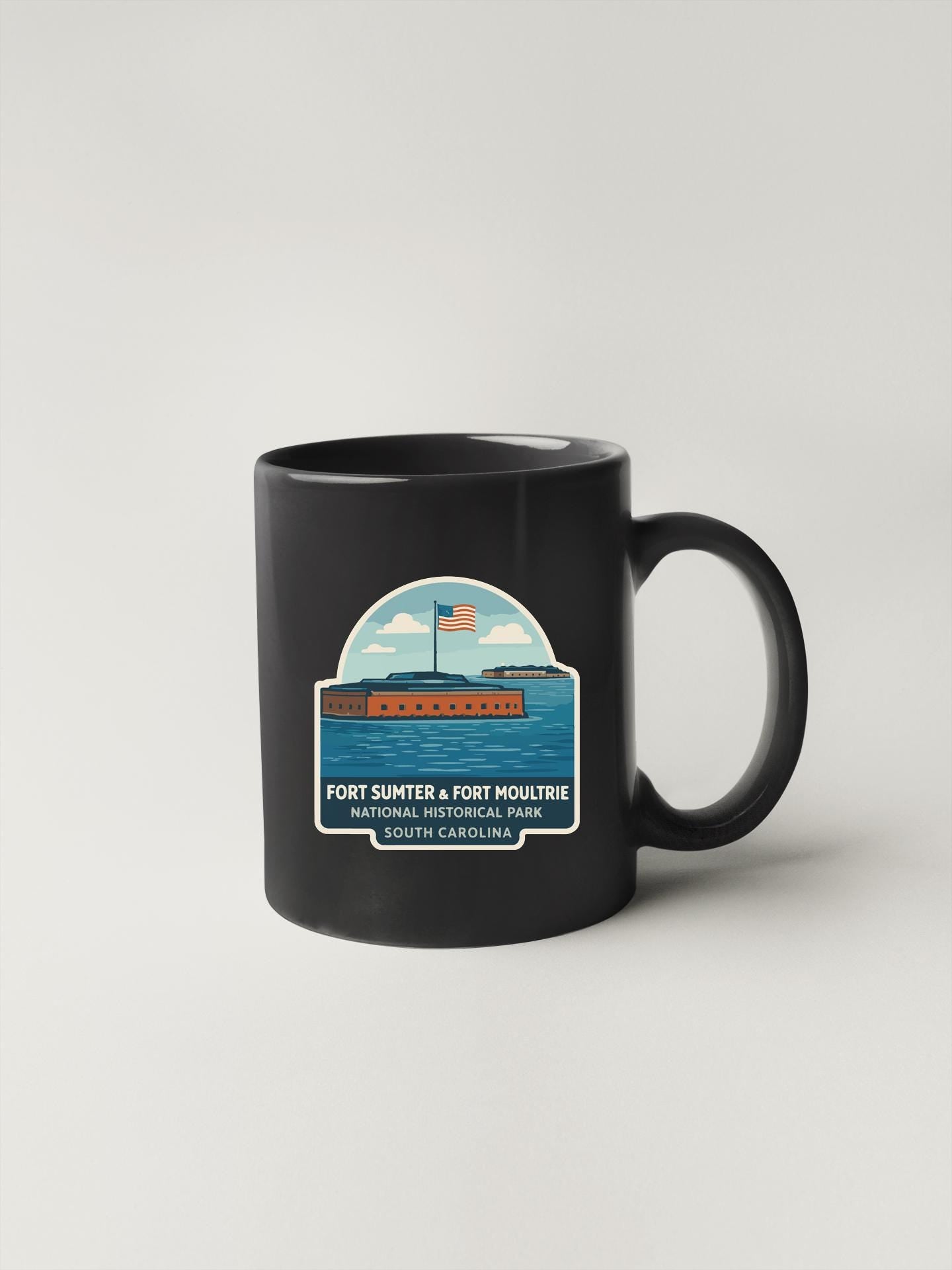 A black coffee mug with a graphic design depicting Fort Sumter and Fort Moutrie, a historic fort located in North Carolina.