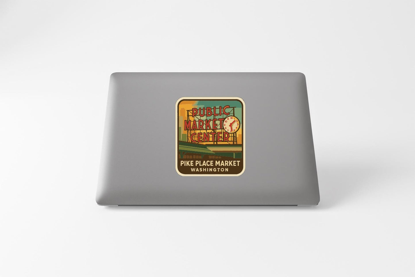 a sticker on a laptop that says "PUBLIC MARKET CENTER PINE PLACE MARKET WASHINGTON".