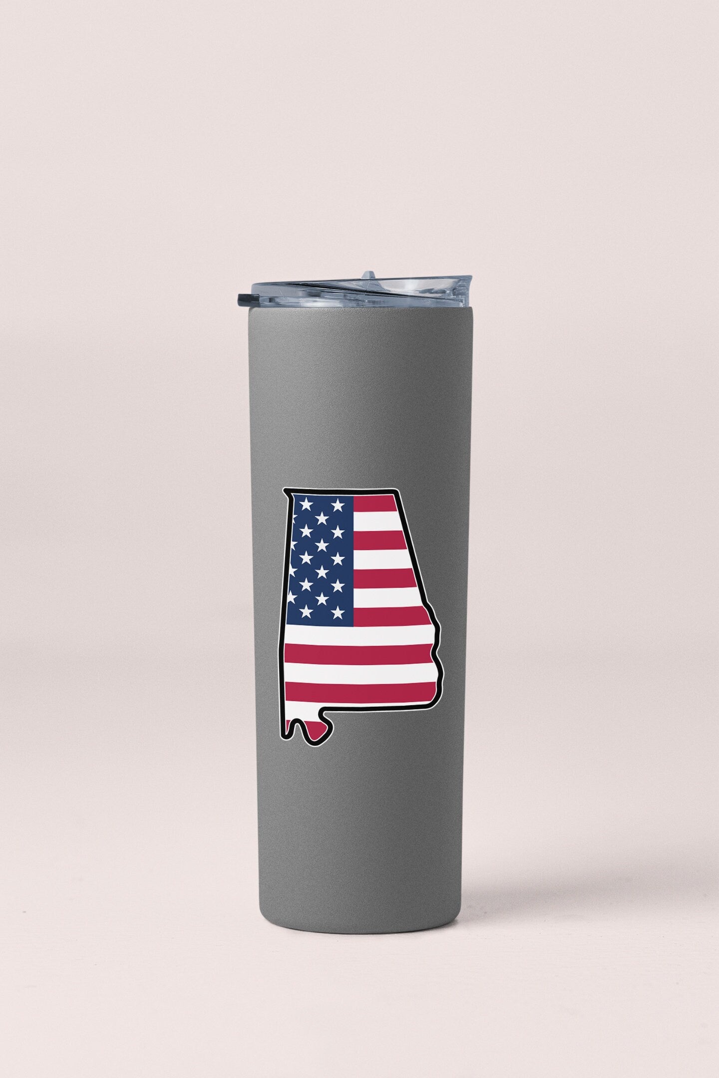 a stainless steel tumbler with the state of texas painted on it